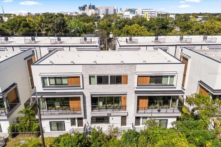Step into modern sophistication with this brand-new 4-bedroom, 3.5-bath luxury townhome perfectly situated in the heart of Orlando’s coveted SODO District. As part of the exclusive SoDo House community—featuring only 23 luxury townhomes—this one-of-a-kind “Floor Plan D” offers the largest living space at 2,307 square feet, delivering truly expansive, home-like proportions rarely found in modern townhome living. This is more than a home—it’s a lifestyle. Located just seconds from Publix, Super Target, AdventHealth, the SODO Shopping Center, Downtown Orlando, and with effortless access to I-4, every convenience is at your doorstep. Inside, you’ll be greeted by a beautifully designed first floor featuring a private bedroom with a full bath and an enclosed 2-car garage, ideal for guests or a stylish home office. The second level embodies modern elegance with a chef-inspired kitchen with new appliances featuring custom cabinetry, a sleek high-gloss quartz waterfall island and pantry. The open-concept living space is enhanced by 10-foot ceilings and expansive windows that flood the home with natural light, creating a light airy ambiance throughout. The stylish half bath on this level adds both function and convenience, perfect for guests and everyday living. The third floor is your personal sanctuary, boasting a primary suite with an en suite spa-style bathroom and two generous closets, plus two additional bedrooms/spaces and another full bath. Enjoy maintenance-free luxury living with HOA covering all exterior and grounds care, allowing you to spend your time experiencing the best of Orlando.