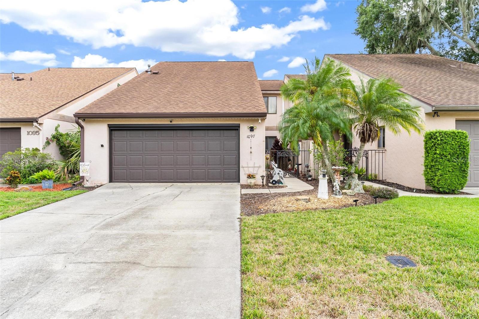Waterfront Living on the Harris Chain of Lakes – No HOA! Welcome to this beautifully updated 3-bedroom, 3-bathroom townhouse with a loft-style bonus room, located in one of Leesburg’s most desirable waterfront communities. Sitting on a beautiful lagoon lot leading directly to Lake Harris and the Harris Chain of Lakes, this property offers the ultimate Florida lifestyle—boating, fishing, and relaxing right outside your door. Inside, the home features a fully remodeled kitchen with top-of-the-line appliances, a built-in wine and coffee bar with wine refrigerator, a beautiful custom backsplash, and soft-close cabinetry with pot-drawer storage. The plumbing has been completely redone, giving peace of mind as well. The spacious great room has vaulted ceilings, a gas-burning fireplace, and direct access to a newly renovated back deck and screened porch with a 220-volt hook up with a hot tub—perfect for entertaining or quiet evenings overlooking the water. The main-floor Master suite includes a remodeled bathroom with a tile shower and double walk-in closets. A private guest suite with its own bathroom is also conveniently located on the first floor. Upstairs, the loft serves as an excellent bonus area for a den, office, or media room, and there is an additional bedroom with a private ensuite and large storage closet upstairs as well. Other features include a spacious two-car garage with screen enclosure and golf cart-friendly access to downtown Leesburg, Venetian Gardens, and UF Health Leesburg Hospital. With no HOA restrictions, this home is a rare opportunity to enjoy waterfront living in a sought-after location complete with plenty of updates. Move right in!