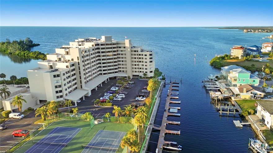 Waterfront Living at Its Finest, this beautifully redesigned three-bedroom, two-bath condominium offering 1,563 square feet of refined coastal living. Thoughtfully updated throughout, this residence blends modern elegance with serene waterfront charm. Enjoy the rare luxury of two private balconies, perfect for morning coffee or evening sunsets while overlooking the water. The interior has been tastefully renovated with high-quality finishes, creating a move-in-ready home ideal for both everyday living and entertaining. Located within a gated waterfront community, residents enjoy exclusive access to a private beach, resort-style community pool, docks with boat slips, and a fishing pier, making it a true boater’s and outdoor enthusiast’s paradise. Please inquire about the availability to purchase a boat slip/dock. Can be used as a Short term rental within the HOA restrictions. Please reach out to the County to inquire about their Short term restrictions. Additional features include under-building parking plus ample guest and outdoor parking, offering both convenience and peace of mind. Whether you’re seeking a full-time residence or a luxurious coastal retreat, this exceptional condominium delivers the perfect blend of comfort, security, and waterfront lifestyle. Minutes away from shopping, fine dinning & entertainment.