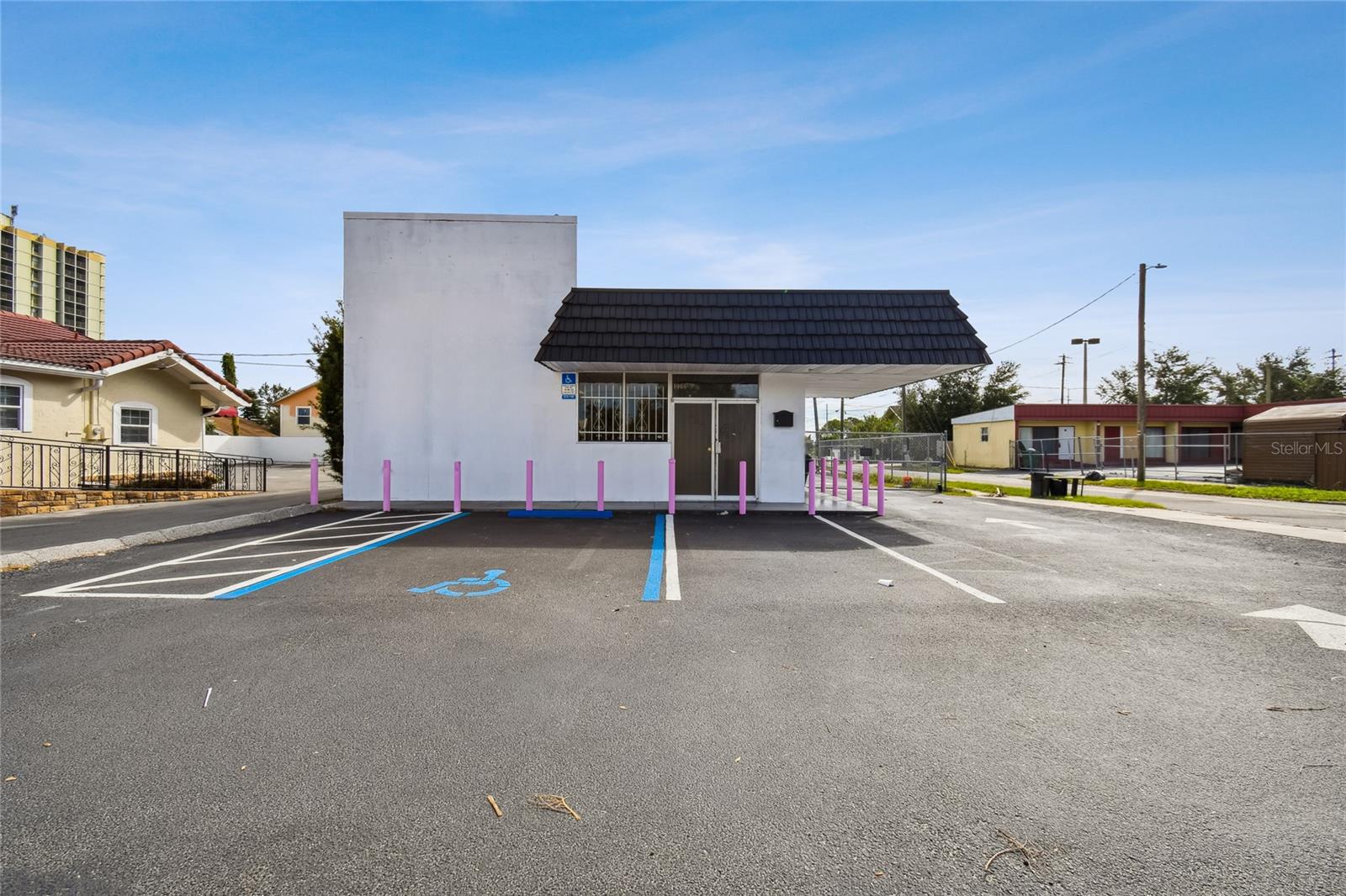 Welcome to this exceptional one-story commercial/retail building, offering 1,581 square feet of versatile space, conveniently located near downtown Winter Haven. This prime corner location features excellent signage and boasts 50 feet of frontage on 6th St NW and 123 feet of frontage on Ave J NW, ensuring maximum visibility and accessibility. Zoned C-3 Highway Commercial, the building was constructed in 1967 with durable concrete (M & S CRNT MULTIPLIER). Inside, you'll find a spacious showroom with impressive 12-foot high ceilings, five well-appointed offices, a storage room, a break room for employee comfort, and two restrooms for convenience. The property includes three asphalt-paved parking spaces at the front and four paved parking spaces at the rear, along with a 211 square foot wrap-around canopy providing additional covered space. Security features include a 6-foot chain-link fence around the side and rear of the building and an electric security door at the front entrance, with both front and back entrances for easy access. Situated in a Community Redevelopment Area with high traffic count, neighboring businesses include retail stores, fast food outlets, motels, office buildings, strip centers, and restaurants. Conveniently located between Lake Howard and Lake Silver, this property offers a vibrant and dynamic environment perfect for a variety of commercial uses. Don't miss the opportunity to establish your business in this thriving area of Winter Haven!