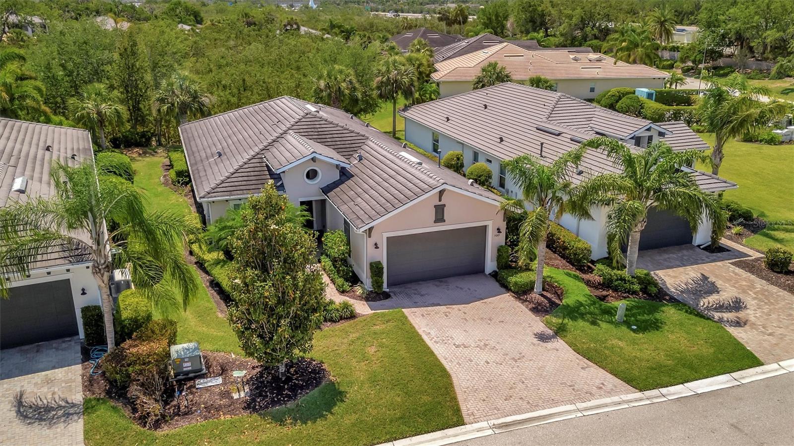 Tour this stunning 3-bedroom plus den, 2-bath, 2-car garage home in Tidewater Preserve—Bradenton’s premier boating community offering direct river access. This beautifully maintained residence comes furnished and features hurricane-impact windows, a whole-home generator, tile flooring in the main living areas, and plush carpeting in the bedrooms. Soaring 10+ foot ceilings with elegant tray detailing add a touch of luxury throughout. Just off the entry, a stylish den/home office offers the perfect space to work or relax. The open-concept kitchen is a true highlight, boasting custom wood cabinetry, a stone tile backsplash, granite countertops, and a spacious island featuring a reverse osmosis system and counter bar that opens seamlessly to the great room. Four hurricane-impact sliding glass doors blend indoor and outdoor living—perfect for entertaining. The luxurious primary suite features tray ceilings, two walk-in closets and a spa-inspired en-suite bath. The en-suite bath includes a garden tub, dual vanities, a custom glass-enclosed shower, and a private water closet. For boating enthusiasts, Tidewater Preserve offers a marina with boat lifts, complete with electric and water, providing direct access to the Manatee River. Whether you're cruising to a favorite waterfront restaurant or exploring Anna Maria Island or Egmont Key, the water is your playground. This gated community features 24-hour guard security and a full-time event coordinator. Residents enjoy three resort-style pools, two fitness centers, a clubhouse, tennis courts, riverfront nature trails, a dog park, playground, kayak launch, and a full-service marina. Best of all—there are no CDD fees. An exceptional home in a premier waterfront community—don’t miss your opportunity to make it yours. Excluded from sale are personal items, small bistro table on lanai and master bedroom bedside table lamps.