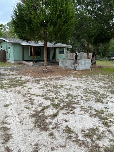 Great investor property! 1.25 acre of land gives plenty of room for a garden and pets. Roof, HVAC and windows were replaced in 2018.
Flooring and baseboards are needed in living room, kitchen and bathroom. Kitchen has new cabinets and granite counter tops. Stainless Steel appliances, Range, Refrigerator and microwave. Home has drywall on all interior walls. Washer and Dryer hook up in Metal Storage building behind home. Bathroom has beautiful new tile shower and cabinet and top. Building in back has has electric on own breaker and water and could be finished as a possible rental or guest house. Detached storage building in back of home with carport. Chain-link fencing needs replaced on the right side of the property. Close to shopping, convenient to Ocala, I75 the Withlacoochee River and Rainbow River. All measurements are approximate and should be verified by Buyer.