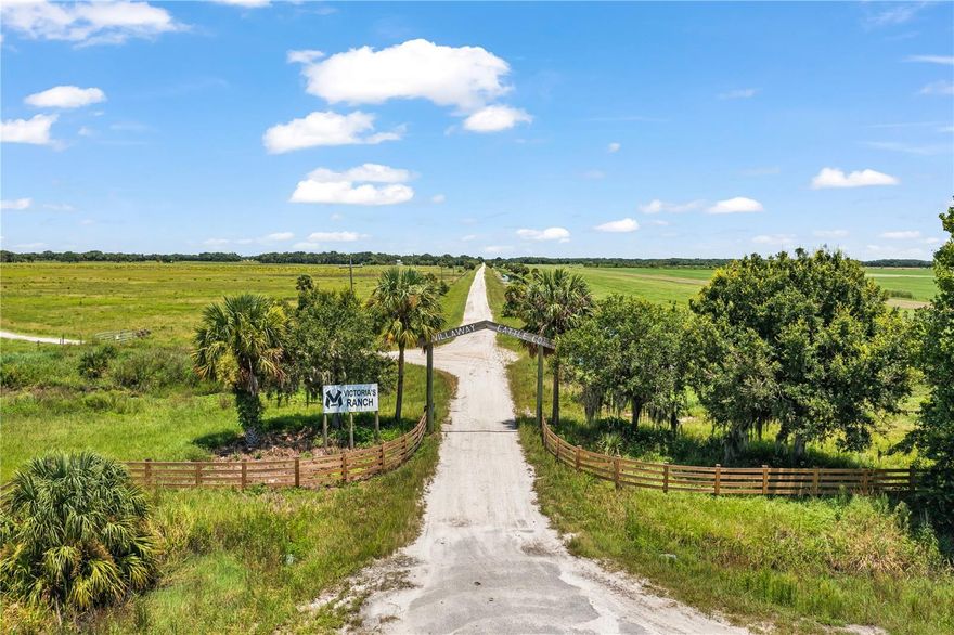 Presenting Victoria's Ranch which stands out as an exceptional working cattle ranch, nestled in the renowned expanse of "prime cow country". Boasting a sprawling 2,368 +/- acres of untamed land, consisting of 75% bahia grass and 14 pastures. This property is a remarkable opportunity for cattle ranching as well as a perfect private family or hunting retreat as well as land banking for future development opportunities. Currently thriving as a bustling cattle ranch, this one-of-a-kind property holds endless opportunities.  At its heart lies an impressive custom main house, meticulously crafted in 2019, spanning 6,361 square feet all on a single level. With 7 bedrooms and 8.5 baths, thoughtful space awaits all who are fortunate to enjoy spending time there. The open floor plan seamlessly unites the expansive great room, gourmet kitchen, and dining area. Adjacent to the great room is a welcoming family room with a full bar perfect for relaxing after a day at the ranch.  The split bedroom design with five en-suite bedrooms on one side of the home and the private primary suite on the other side of the home offers the ultimate in privacy and exudes rustic elegance. The secluded primary suite graces one full side of the home, featuring direct access to the pool and outdoor oasis. Two expansive walk-in closets and a spa inspired bath epitomizes casual elegance. An additional secondary bedroom suite, perfect for a home office or gym, compliments the thoughtful split-bedroom layout. Convenience prevails with dual laundry rooms in addition to a generous interior storage room. Stepping outside into the tropical oasis where the resort-style pool takes center stage, complete with a rock feature slide. The sprawling patio hosts a summer kitchen, grill, fire pit, pool bath, and generous space for outdoor entertaining. The allure extends with your own private baseball field, adding an extra layer of recreational amenities! Beyond the primary residence, Victoria's Ranch boasts a secondary two-story dwelling – perfect for a ranch manager, which was originally constructed in 1996. For those passionate about equestrian pursuits, a 3,086 SF horse barn built in 2015 conveniently awaits you. The property further encompasses a 5,354 SF storage/equipment barn/office, a mobile home, well appointed cattle pens, a versatile pole barn, and additional storage building. Victoria's Ranch isn't just exceptional – it's an embodiment of extraordinary possibilities. Whether envisioning a luxury family retreat, indulging in diverse recreational pursuits, skillfully managing equestrian and cattle ranch operations, or future development opportunities, this incredible ranch offers unparalleled opportunities. Conveniently located 21 miles North of the City of Okeechobee and 25 miles west of I-95 in Ft. Pierce. Close proximity to Florida's Turnpike at SR 60 (Vero Beach/Lake Wales) make this offering most accessible.