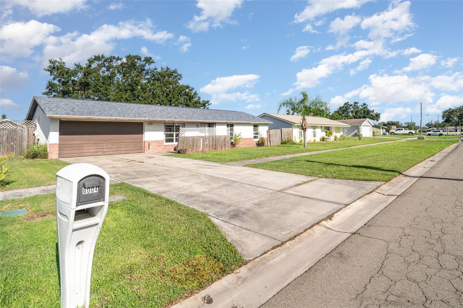 Welcome to 6004 Firefly Ln! This 3-bedroom, 2-bath block home in the heart of Apollo Beach features a BRAND-NEW ROOF (2025), a new WH (2023), no HOA or CDD fees and NO FLOODING from recent hurricane. Situated on a nice-sized lot with a fully fenced backyard, the property offers plenty of outdoor space for relaxing, entertaining, or enjoying the Florida sunshine.
Inside, the bright and functional layout includes flexible living areas, a dedicated laundry room, and a bonus storage room for added convenience. With great bones throughout, this home provides the perfect opportunity to add your personal touch and make it truly your own. Ideally located just minutes from top-rated local attractions like Apollo Beach Nature Preserve, Manatee Viewing Center, Circles Waterfront Restaurant, and Little Harbor Marina—this home is perfect for outdoor enthusiasts and foodies alike, from first-time home buyers to investors. Families will appreciate proximity to highly rated schools, including Waterset Charter School and East Bay High School.
Move-in ready with major updates in place, this Apollo Beach gem is waiting for you—schedule your showing today!