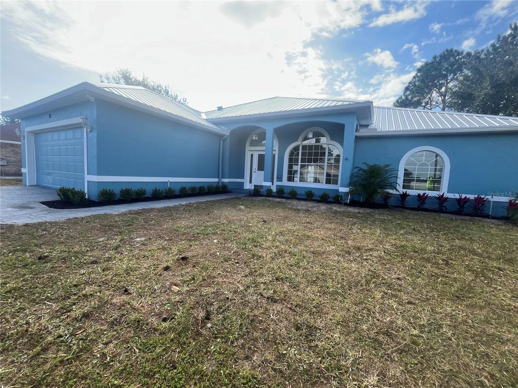 Photo of 10 Lewis Shire Place, Palm Coast, FL 32137 (MLS # O6369088)