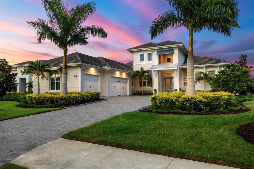 Within the prestigious gates of The Lake Club, this stunning 4-bedroom, 5.5-bathroom estate with a private casita/bonus room and dedicated office embodies the pinnacle of elegance and resort-style living. Positioned on a serene lake with no neighbors behind, the home offers privacy and sophistication. From the moment you arrive, the paver driveway, mature landscaping with accent lighting, and a 3-car side-load garage set the tone for the refined lifestyle within. Step through the double-door entrance into a thoughtfully designed open floor plan with soaring ceilings, IMPACT GLASS windows and doors, and seamless indoor-outdoor living. The great room boasts 14-foot custom wood ceilings, 12-foot sliding doors, tile plank flooring, and custom built-ins, while the chef’s kitchen dazzles with stainless steel appliances, wall oven with convection, microwave, oversized island, dry bar, quartz countertops, and a walk-in pantry with wood shelving. The primary suite is a private retreat with double glass doors opening to the lanai, remote-controlled shades, custom closets and a spa-like bathroom featuring a walk-in shower, soaking tub, split vanities, and quartz countertops. Each additional bedroom includes an en-suite bathroom, ensuring comfort and privacy for family and guests. A highlight of the home, the casita/bonus room offers a private double-door entrance, en-suite bath with walk-in shower, quartz counters, wet bar with wine refrigerator, and remote-controlled shades—ideal as a guest suite, media room, gym or retreat. The den/study impresses with double glass doors and custom built-ins. The outdoor living area is designed for entertaining and relaxation. A panoramic screen frames sweeping water views, while the expansive lanai features a custom wood ceiling, tile deck, gas fireplace, outdoor kitchen with gas grill, wet bar, and refrigerator. The heated saltwater pool with sun shelf, infinity-edge spa, and water feature creates the perfect backdrop for resort-style living, enhanced by hurricane-rated remote-controlled screens for year-round comfort. Additional highlights include a bedroom with zero-edge sliding doors to the lanai and pool bath access, fenced yard, whole house generator, Sonos Smart Home system with Wi-Fi extenders, dimmer switches throughout and a separate laundry room with Whirlpool washer/dryer, sink, cabinets, quartz counters, and a whole house water treatment system. This home is the perfect combination of timeless design, luxurious finishes, and modern conveniences, all within Lakewood Ranch’s most coveted community renowned for its exclusive amenities, clubhouse, and lifestyle. Residents of The Lake Club enjoy a world-class array of amenities, including two resort-style heated pools, a newly renovated clubhouse with fine dining and bar, state-of-the-art fitness center, spa, tennis and pickleball courts, playground, and two dog parks—all enhanced by the services of a full-time concierge and activities director. Beyond the gates, you’re not far from award winning beaches and just minutes from The Mall at University Town Center, Lakewood Ranch Main Street, Waterside Place, downtown Sarasota and an abundance of shopping, dining and cultural destinations.