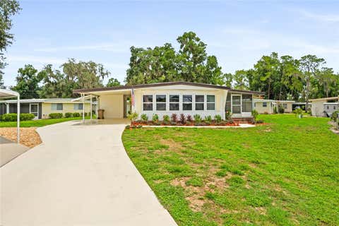 Photo of 150 Azalea Trail, Leesburg, FL 34748 (MLS # O6426652)