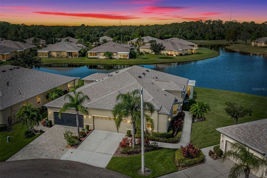 Under contract-accepting backup offers. A SPECTACULARE WATER VIEW AND GORGEOUS FLORIDA SUNSETS await you in this large 2-bedroom, 2 bath + den home in Kings Point, a premier 55+ community in West Central Florida. This Minto built Banyon model is even larger with its expanded, enclosed, air-conditioned Florida room overlooking the ponds and golf course beyond. Situated on an over-sized premium lot with no backyard neighbors, space and privacy abounds. This is the only floor plan with a 2 ½ car garage, perfect for cars, golf cart or workshop area. Enter through the screened entryway into the spacious foyer which leads you directly into the great room. Your eye is immediately drawn to the relaxing water view. The kitchen boasts 42” cabinets, Quartzite (real quartz!) countertops, tile backslash, stainless steel appliances, Shelf-genie pull-out shelves in the pantry and lower cabinets, under-cabinet lighting and pendant lighting over the island. The dining area is spacious and can easily accommodate a large table and chairs. The living area with its tray ceiling is also spacious and perfect for entertaining. The great room has 20” porcelain tile with LPV in the primary bedroom and den and carpet in the guest bedroom. The primary bedroom is at the rear of the home and also enjoys the peaceful water view. There’s a large walk-in closet and en-suite bath with a spacious step-in shower, his and her vanities, and a private water closet. The guest bedroom and guest bathroom are located at the front of the home with the den in the middle. The den has pocket doors which allow for privacy in that space and certainly could be used as additional guest accommodations. This home has space for all your family and friends! But the real showstopper is the expanded, enclosed, and air-conditioned Florida room.  With almost 250 square feet of additional living area, you’ll want to spend all your time there. This space speaks relaxation! Although air-conditioned, the A/C to the Florida room can be closed (via a switch) along with the stacking sliders to allow you to open those windows and enjoy the fresh Florida air. Of course, there’s an inside laundry room with sink and storage cabinetry. This home has so many extras and upgrades like a new roof (02/2025), hurricane impact windows, a 50-gallon hybrid hot water heater, HEPA whole house air filtration system with UV light coil sanitation filter, a premium wi-fi controlled thermostat and Hunter-Douglas duet blinds.  Located on a quiet cul-de-sac in the pet-friendly Richmond community, this is a must-see home! Listed as a condo for MLS search convenience, this beautiful home is a villa.  You own the land, but the HOA covers lawn care, building painting, water, sewer, cable tv and internet and pest control. Conveniently located near beaches, medical facilities, theme parks, and major sporting venues, Kings Point is a golf cart friendly community that offers 5 pools, jacuzzi, sauna, steam room, tennis, pickleball, lawn bowling, a 850 seat theater with shows and parties, a state of the art fitness center, a wood shop, ceramic/pottery room, sewing room, cafes and its own sports bar! There are over 100 clubs and activities for you to enjoy! All within a private, gated community with 24-hour manned gates! Enjoy a limited time reduction in the monthly HOA fee from $615/mo. to just $83/mo. through 03/2026. If you’re looking for a home, large enough for all your visiting friends and family with a stunning view, this home is for you! Paradise is waiting!