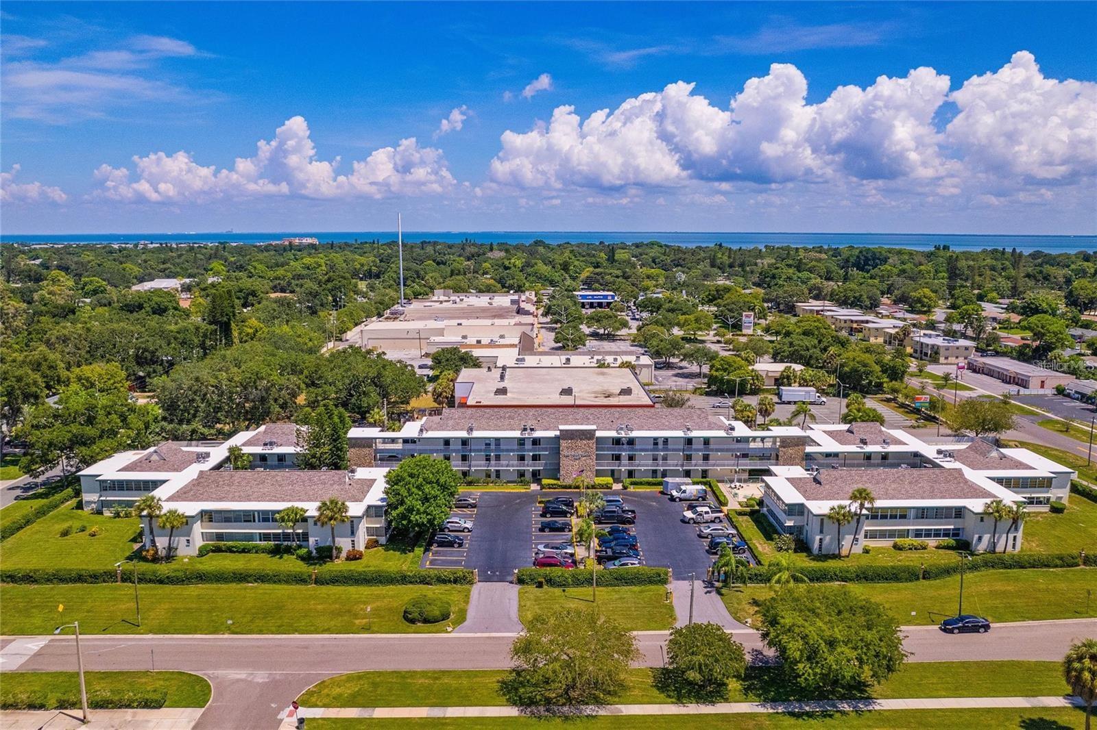Currently tenant occupied. Welcome home to this well-maintained and beautifully updated gated condo in Bay Point Plaza. This rarely available 2 bedroom, 2 bathroom, second floor corner residence has it all, including an extra 240 square foot Florida room with corner wrapping, newer glass windows providing expansive park views and tons of natural light! Enjoy a brand new, never used kitchen with modern finishes, including Corian, solid surface countertops, white cabinetry, stainless steel appliances and luxury vinyl plank flooring. Additional upgrades include fresh painting throughout the entire residence, new light fixtures, bathroom fixtures, and an upgraded electrical panel and new building roof in 2020! Your spacious master bedroom and en-suite bathroom are at the end of the hall, offering full privacy and beautiful views from the two windows looking over the trees. The guest bedroom is large enough to create an in-home office and bedroom, or private guest suite with full bathroom next door. Bay Pointe Plaza is conveniently located across the street from Lake Vista Park, which offers a beautiful view, tennis courts, basketball courts, pool and water slide, a scenic lake, walking trails leading to the Pinellas Trail, community center and much more! Make this home yours, and you will enjoy the close proximity to St. Pete Beach and Ft. Desoto, and the interstate is located minutes down the road for easy access to Downtown St. Pete, the Skyway Bridge or Tampa. Schedule your showing now to live in this beautiful community and call this home or your next investment.
