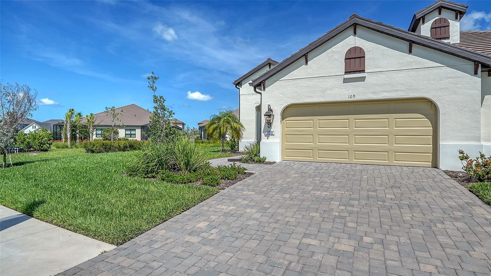 Spacious 1,848 sq. ft. The Sandcastle-2 Neal Communities largest Villa plan. 3-Bedrooms, 2-Baths, 2-Car garage, plus a Den. A large island with plenty of counter space can be found in the Kitchen overlooking the Great Room and Dining area, ideal for enjoying fun with family & friends. This home is optioned with Impact Resistant Glass, 8' Interior Doors, Paver Driveway, walks & Lanai. A Pocket Sliding doors leads to an extended screened Lanai. It also has a Laundry Room with Sink.