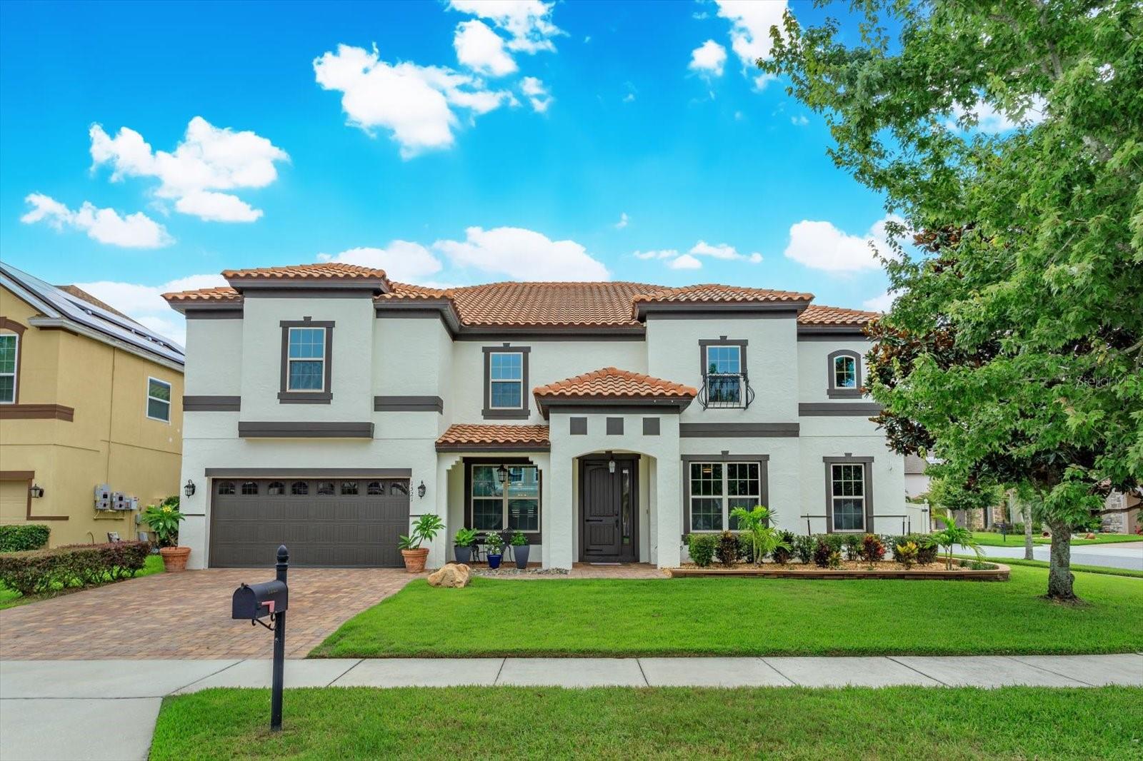 Enjoy the Central Florida lifestyle in this stunning home located in the desirable, gated community of East Lake Park. Situated on a corner lot with excellent curb appeal, you will be welcomed into this sleek and stylish home. Built by Meritage Homes, the “Del Rio” model features an open floor plan with 7 bedrooms/4 bathrooms, 3-car tandem garage, separate dining room, living room, office/den, family room, game room, media room and laundry room. The floor plan flows seamlessly and is ideal for the multi-generational family. Offering two primary suites (one on each floor) – with dual sinks, soaking tub, separate shower, water closet and expansive walk-in closets. Neutral paint tones and plenty of natural light abound in this home along with an abundance of storage. The kitchen is ideal for the aspiring chef in your family - highlighted by 42” espresso cabinets, granite counters, under cabinet lighting, new stainless steel appliances, striking backsplash, adjacent butler’s pantry and breakfast nook. The first floor also features a guest room and full bath. The second floor has 4 bedrooms (in addition to the second primary suite) along with a large game room and media room. Extend your living area outdoors with a huge covered lanai – all in a serene and private setting. This Energy Star home includes: spray foam insulation, programmable thermostats, low E2 vinyl insulated windows, 15 Seer HVAC, weather-sensing irrigation system and high-efficient plumbing fixtures. Additional upgrades: new exterior paint, front porch lighting, retaining wall, plants and landscape rock in front yard, sprinkler heads replaced with high efficiency sprinklers, vanity light fixtures in bathrooms, 12 ceiling fans, new door handles and cabinet hardware, laundry room cabinets, shelving and backsplash. Conveniently located to Lake Nona and Medical City, shopping, restaurants and major roads. This home is turn-key and will exceed your expectations!