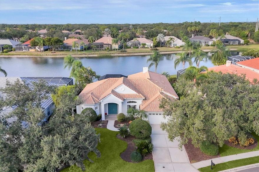 ROOF (2019), Refurbished pool cage (2022), AC (2024) and much more! Walk through the front door and be immediately captivated by the spectacular lakefront view! The inviting foyer opens to an impressive formal dining room, spacious enough to comfortably host twelve guests—ideal for memorable gatherings with family and friends. The living room offers an atmosphere of refined relaxation with panoramic views of the sparkling pool, lush year-round landscaping, and the tranquil lake beyond. A well-appointed gourmet kitchen provides everything needed for culinary creativity and seamlessly connects to the open family room, where a cozy gas fireplace and expansive sliding doors perfectly frame the breathtaking water vistas. The den/office, enhanced by large windows overlooking the lake and double doors leading to the lanai, is destined to become your favorite room—ideal for a home office, studio, or additional guest space. Two private guest suites are thoughtfully situated on one side of the home, each with its own full bathroom for ultimate comfort and privacy. The primary suite is truly extraordinary, featuring an oversized bedroom, two generous walk-in closets, and a spa-inspired bathroom designed to rival a five-star resort, complete with a whirlpool tub, dual vanities, and a spacious double shower. Lovingly owned and meticulously maintained by the original homeowner, this remarkable residence offers luxury living at its finest with picture-perfect lake views from nearly every angle. EXPERIENCE The University Park With its mature landscape and sprawling natural beauty, University Park is the premier master-planned community in the Sarasota area. Behind the secured, staffed entrance is an award-winning, resident-owned community featuring 27 holes of four-star rated golf, eleven lighted Har-Tu tennis courts, four pickleball courts, a fitness center, croquet, miles of tree-lined streets for walking or biking, and first-class dining. Also offered are numerous social activities and many social clubs designed to fit a variety of interests. Located only four miles from downtown Sarasota and its spirited arts community, museums, shopping, dining, and first-class healthcare, University Park is an oasis from the City but close enough to all amenities. It's only a short 15-minute drive to some of America's finest beaches, superb outdoor recreation areas, including the internationally renowned Nathan Benderson Park, the famed Ringling Museum, various boating options, and the acclaimed St. Armands Circle. University Park's breathtaking beauty is unmatched by any other.