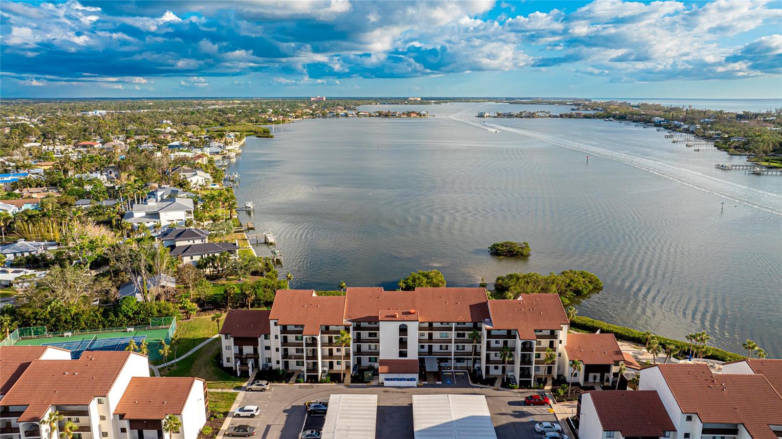 One or more photo(s) has been virtually staged. Welcome to your piece of paradise at Castel Del Mare, just a short walk or bike ride across the bridge to the white quartz sand beaches of Siesta Key! This beautifully maintained ground-floor, 2-bedroom, 2-bathroom waterfront condo offers the ultimate coastal lifestyle.
The home features brand-new hurricane-rated windows (2022) and doors (2024), ensuring both safety and modern appeal. Freshly painted throughout, the interior boasts elegant flooring, a new dishwasher and microwave (2024), and recently updated appliances, including a stove and refrigerator (2021). A tankless water heater and thoughtful upgrades throughout make this condo truly move-in ready.
Step outside to enjoy serene views of the Intracoastal Waterway or unwind at the private dock—perfect for fishing or relaxing by the water. This unit includes an assigned covered carport space, additional storage with additional guest parking available.
As part of the Castel Del Mare community, you’ll have access to exceptional amenities, including two heated pools, tennis courts, shuffleboard, a clubhouse, and a charming gazebo with a boardwalk along the bay.
Conveniently located near numerous dining and shopping options, this home combines coastal charm, modern comfort, and unmatched convenience. Don’t miss this rare opportunity—schedule your private showing today