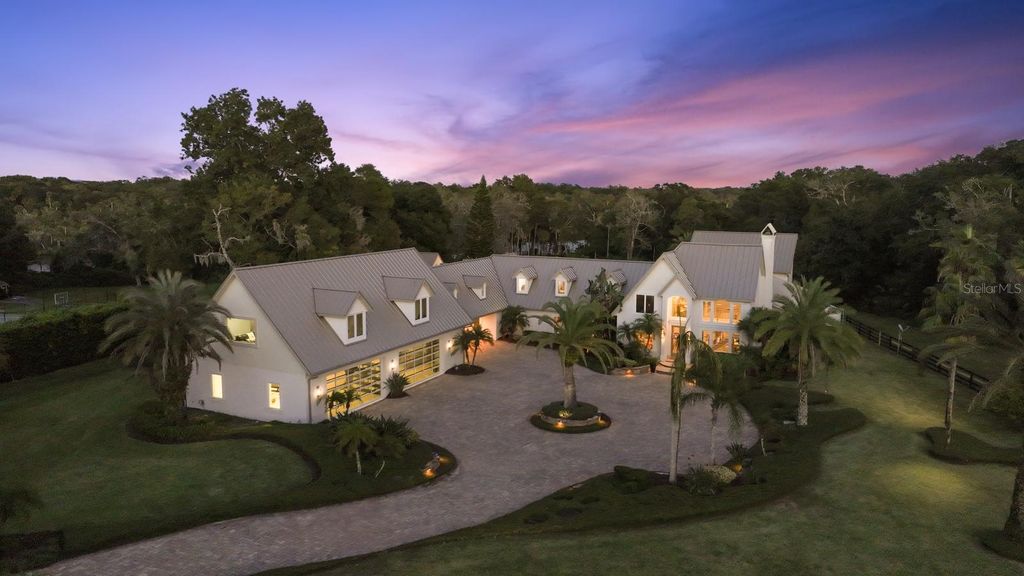 Photo of 427 Pine Bluff Trail, Ormond Beach, FL 32174 (MLS # V4944387)