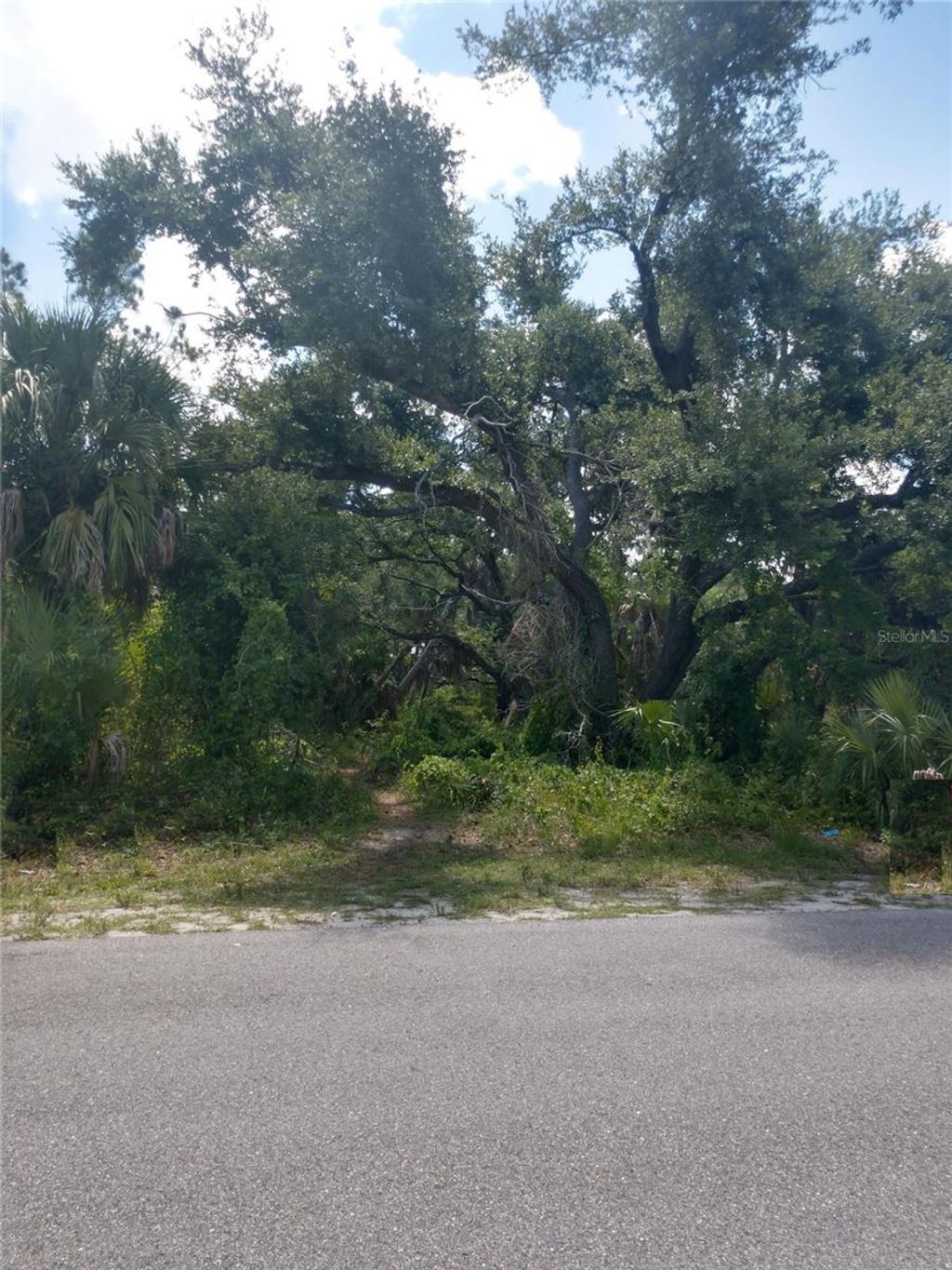Photo of 1420 Kenesaw Street, Port Charlotte, FL 33948 (MLS # O6266231)