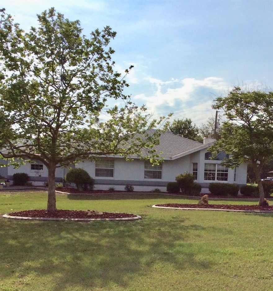 Private, gated estate just 4 miles from the WEC, this offers versatility, space, and income potential on nearly 2 fully fenced acres—set back from the road for peace and quiet, with a paved driveway and surrounded by upscale homes and horse farms.

The property features a main residence plus a fully furnished two-story guest/in-law apartment, ideal for multi-generational living or rental income. The main home includes a library, living and dining rooms, kitchen, laundry/office, two bedrooms with a Jack-and-Jill bath, and a two-car carport.

The apartment offers exceptional flexibility with multiple living spaces, bedrooms, kitchens, laundry rooms, and an upstairs suite with chair lift access. A former wall can easily be restored to create an additional bedroom upstairs.

Outdoor highlights include a greenhouse with water and electric, an organic fruit orchard, patio space, waterfall with pond, extensive landscaping, RV hookup with electrical connection and dump station located at the rear of the apartment building, multiple garages and carports, and six outdoor water spigots.

Additional features: both buildings are equipped with hookups for large gas generators, and the property includes a large gas generator/arc welder capable of powering the entire home during outages, along with a golf cart, tools, double-insulated attic, newer A/C systems, newer roof, awnings, and fresh exterior paint.

Move-in ready with endless possibilities—private retreat, family compound, or investment opportunity.