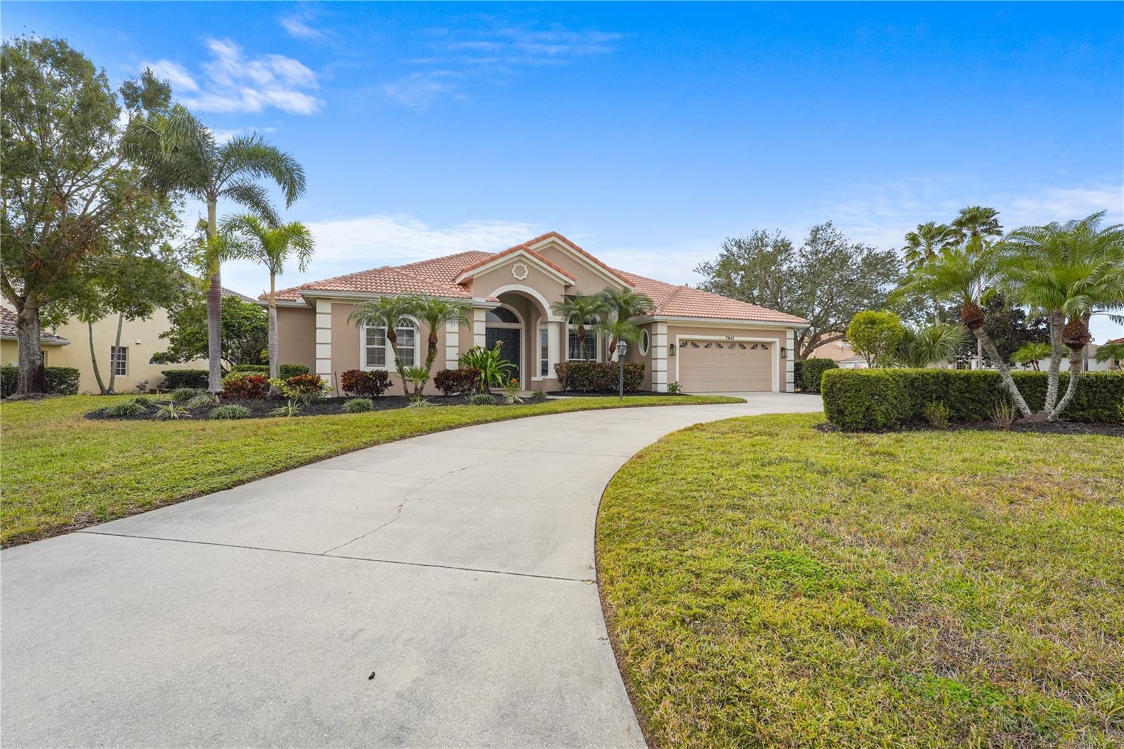 Welcome to the highly sought after community of Lakewood Ranch Country Club where you can tee off tomorrow with no wait list to become a member! Mere minutes ride to the clubhouse, this amazing opportunity is not to be missed for the golf lover featuring 72 holes of private championship golf with four distinctive golf courses. This updated, custom-built, 5-bedroom, 3-bathroom Todd Johnston pool home is a rare find as it sits on a gorgeous stately corner lot with a fenced backyard and a water view. Upon entering, you’ll find a bright open modern floorplan with high-end finishes throughout including natural stone, travertine flooring and stone countertops; as well as an incredible chef- inspired kitchen with custom cabinetry and high-end, oversized stainless steel built-in gas appliances. The home’s high ceilings and large wall-to- wall pocket sliding doors fill this home with light and showcase the lush private landscaped exterior from all main common rooms. You will fall in love with the gorgeous sunsets overlooking the saltwater pool area, perfect for those who love to entertain, or just enjoy the beauty of Florida living. With 2 of the 5 bedrooms off the secondary living area, this home’s unique split living areas provide flexible living space to use however it suits your needs; as a multi-generational / guest suite or even an office or a game room area. Enjoy the Lakewood Ranch lifestyle with a private Country Club, four golf courses, 18 lighted tennis courts, athletic facility, polo club, parks, close knit all-inclusive feeling of community with 3 optional membership tiers. Close to Lakewood Ranch Main Street, fine dining and shopping, A-rated schools, world-class beaches and more. Luxury living at its finest!