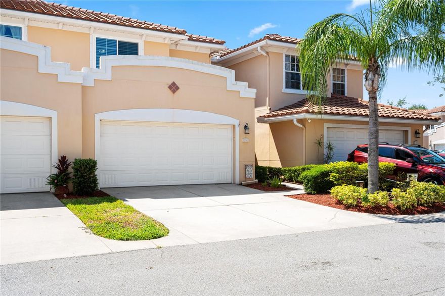 Welcome to your beautifully upgraded townhome in the desirable Villas of Carillon community. From the private front entry to the open-concept layout, every detail of this home blends style and function. This unique floorplan is the only one in the community featuring a first-floor primary suite combined with dramatic double-height ceilings in the living area, creating the feel and openness of a single-family home rather than a traditional townhome.

The kitchen is very practical, featuring granite countertops throughout, 42” hardwood cabinetry, newer appliances and spacious double pantry for storage.  The light-filled living area opens seamlessly to a screened-in lanai, perfect for relaxing or entertaining, while a powder room on the main level adds convenience for guests.

The expansive first-floor primary suite is a true retreat with upgraded built-in walk-in closets  and expanded shower with porcelain tile and glass accents. Upstairs, the versatile loft area offers endless possibilities and can easily function as a second living room, playroom, craft room, media room, or home office. Two additional bedrooms and a laundry room completes the upper level.

The oversized two-car garage provides additional overhead storage, while community amenities include a heated pool and clubhouse. Ideally located near both Tampa International and St. Pete-Clearwater Airports, this townhome also offers peace of mind with no flooding history. Move-in ready with elevated upgrades throughout—don’t miss the opportunity to own one of the most desirable floorplans in Villas of Carillon.