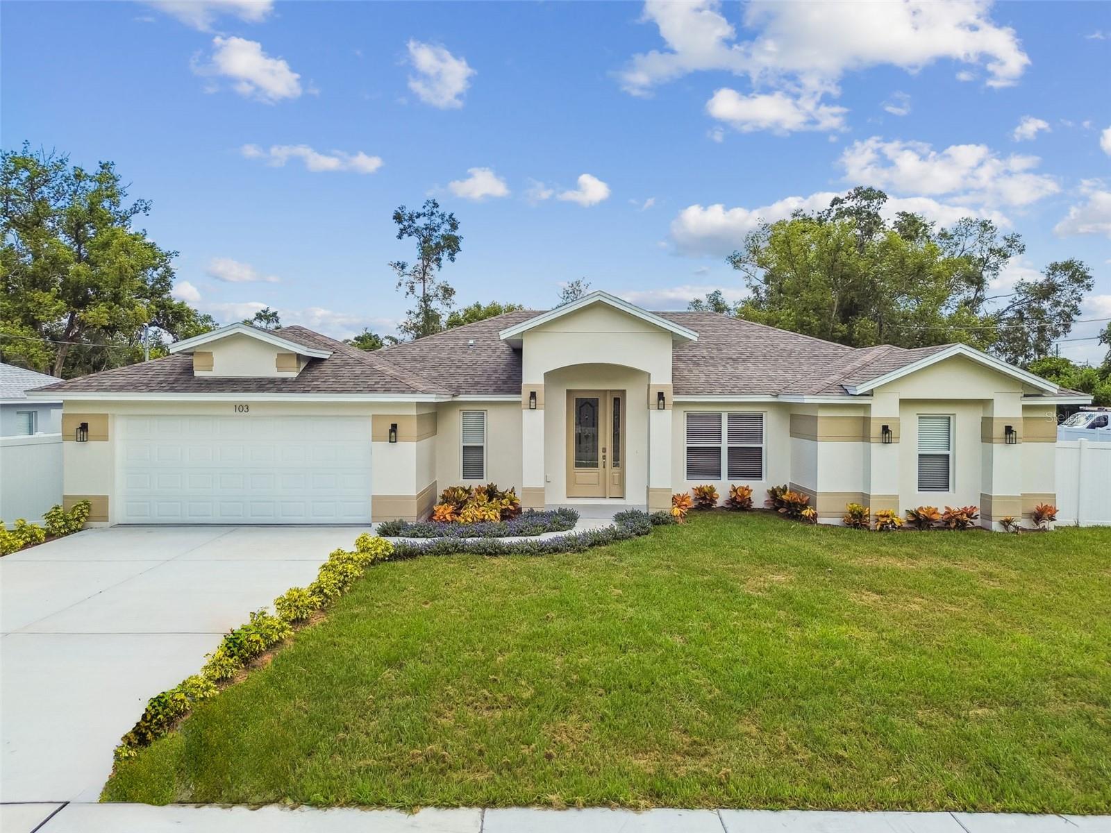 Enjoy brand new construction without the wait, or the hassle of HOA fees and deed restrictions! Welcome to this beautiful 4-bedroom, 3-bathroom home with an office and 2-car garage, perfectly situated on over a quarter-acre lot just 30 minutes north of bustling Downtown Tampa. Built with solid block construction and impact-rated windows, this home is located in Flood Zone X for added peace of mind. Inside features stylish tile flooring throughout with a split-bedroom floor plan, offering three spacious bedrooms on one side and a private and spacious primary suite on the other. The modern kitchen features quartz countertops, shaker-style cabinetry, a pantry, and a large island with a breakfast bar, stainless steel appliance package, and is complemented by a cozy dinette area for additional dining space. The property sits on a corner lot spanning 100x125, and the backyard is fully-fenced in with vinyl fencing and provides privacy and ample room for outdoor enjoyment. Conveniently located just 30 minutes north of Downtown Tampa, Tampa International Airport, and International Plaza, all the best of this growing city is a short drive away while you enjoy the peace and quiet of suburban living. Don’t miss this rare opportunity to own a brand-new home without the long wait—schedule your private showing and make this home yours today!
