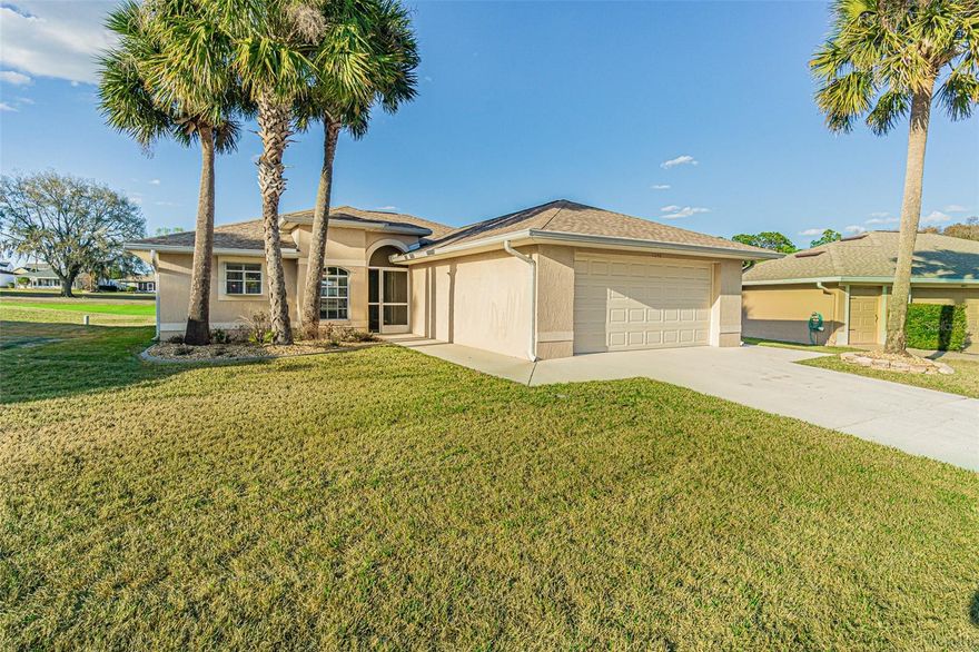 COME to SUNNY FLORIDA! Welcome to resort-style living in the guard-gated 55+ community of Tampa Bay Golf & Country Club, where this beautifully maintained one-owner home offers STUNNING golf course views. This inviting 2-bedroom, 2-bath residence with a 2-car garage sits on a premium homesite overlooking the rolling greens of Hole #5 and a tranquil pond from guest bedroom, providing a picturesque setting you can enjoy every day. Step inside to discover a light and bright open floor plan featuring cathedral ceilings, fresh interior paint, luxury vinyl plank flooring, and a ceramic tile foyer that welcomes you into the spacious living and dining areas. The updated kitchen shines with newer stainless steel appliances and elegant quartz countertops, perfect for both everyday living and entertaining.  Architectural archways add charm throughout the home, while sliding glass doors lead to a screened lanai where you can relax and take in the peaceful golf course scenery. The spacious owner’s retreat also captures those beautiful views and includes a private ensuite bath with dual sinks, a soaking tub, separate shower, and a generous walk-in closet. A comfortable guest bedroom enjoys pond views, just off the guest bath, making it a perfect space for visiting family and friends. Outside, attractive concrete curbing, rock landscaping, and a lush lawn create wonderful curb appeal, while the screened front entry allows refreshing cross breezes through the home. Additional highlights include a new water heater in 2023, a convenient side door exit from the garage, and a washer and dryer that convey with the sale. This move-in ready home offers the perfect blend style, functionality, and the vibrant lifestyle that makes Tampa Bay Golf & Country Club so desirable. Deer Hollow village has the lowest fee and you have an option for lawncare choice...mow it yourself, hire your own lawncare service or for a nominal fee, the same lawncare service the other communities use can be hired. Enjoy the NUMEROUS amenities available in this active community:  Tennis, Pickleball, corn hole, shuffleboard, billiards, fitness center, card rooms with poker tables, art and exercise classes, 2 swimming pools, library with computers, game rooms, onsite restaurant, pub/grille, banquet facilities with dance floor and stage, planned social activities, onsite entertainment AND travel excursions available. Located North of Tampa just one exit north of Wesley Chapel for easy commute to work, shopping, medical facilities, premium outlets, restaurants, Tampa, Ocala, Orlando, Lakeland, Airports or the Famous Gulf Beaches! CALL TODAY to see why this IS the place to BE!