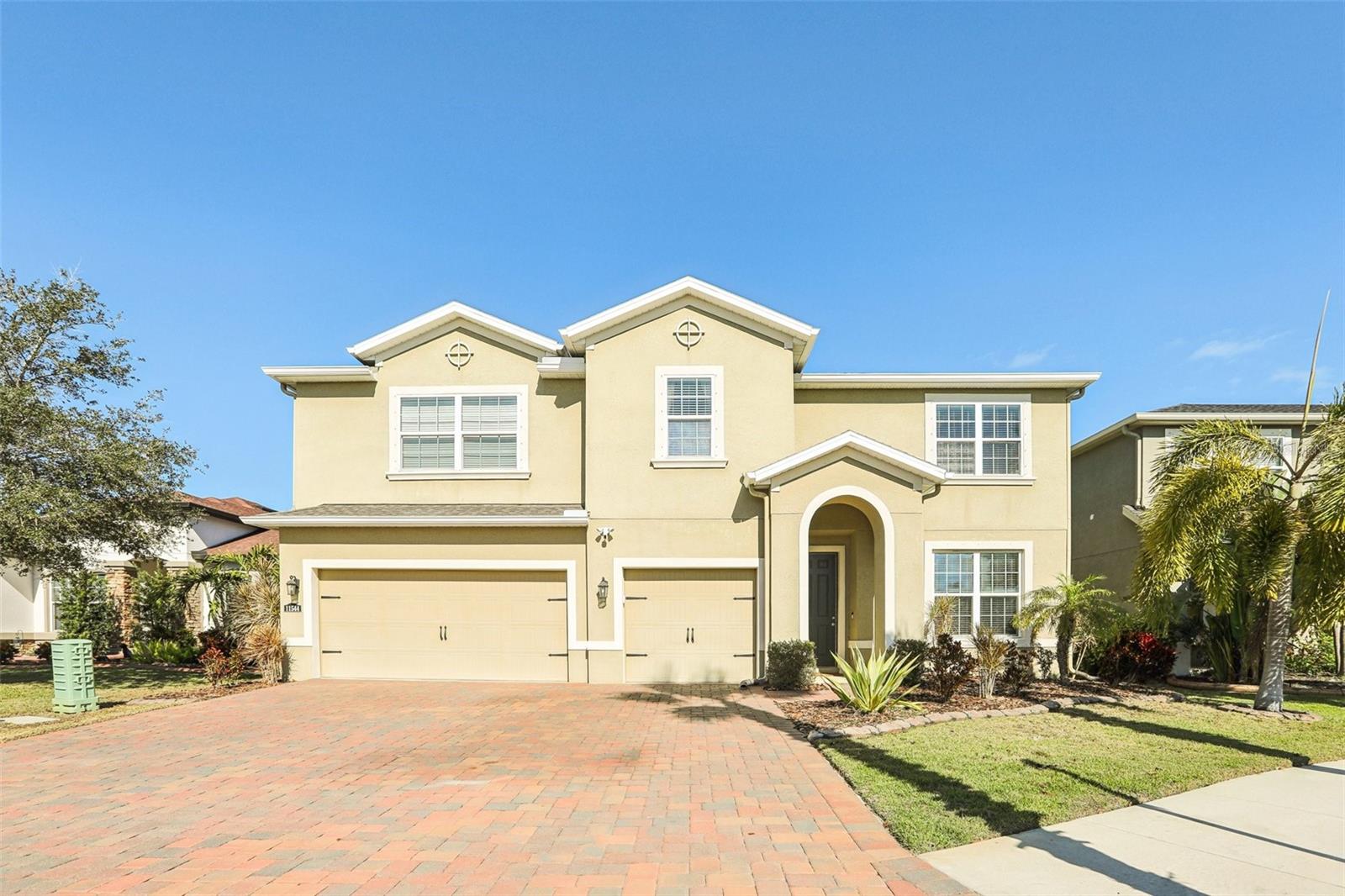 Located in the GATED community of Lucaya Lake Club, this 4-bedroom + den, 3.5 bath, 3-car garage home spans 3,456 SqFt of living space. Entering the foyer, French Doors lead into the den which can be used as a home office or converted to a 5th bedroom. The Gourmet kitchen boasts GE stainless steel appliances, pantry closet, recessed lighting, and granite countertops with center island that opens to the living room and breakfast nook. With glass sliders leading out onto the expansive screened-in lanai and fully fenced backyard- HOT TUB INCLUDED, there is true indoor/outdoor living where plenty of time will be spent relaxing or entertaining family and friends. There is room to add a pool and the nearby full bath (or future pool bath) has direct access from the lanai. The first floor primary bedroom is complete with Tray ceilings, large walk-in closet and an ensuite bath that features dual vanity sinks, a glass enclosed shower and separate soaking tub. A conveniently located laundry room and half bath complete the main level. Upstairs, the loft provides a flex space that can be used as a secondary living room, movie room, or game room and so much more. Down the hall are 3 generously sized bedrooms, offering ample closet space and share the remaining full bath. This home has been constructed with R-38 insulation, cement blocks, multi-step inspections along the way, and has been pre-wired to add a generator. Lucaya Lake Club is an all-natural gas community which has resort-style amenities including a zero-entry pool with lap lanes, splash pad, covered cabanas, a sandy beach, playground, clubhouse with fitness center, plus a boat ramp and dock that can used for fishing, kayaking, paddleboarding, canoeing, and more on the 78 acre lake! The clubhouse can be rented for private events for a nominal fee. Premier location with proximity to schools, shopping, dining, I-75, US-301 and the Selmon Expressway for easy commuting into downtown Tampa, Tampa International Airport and MacDill Airforce Base.