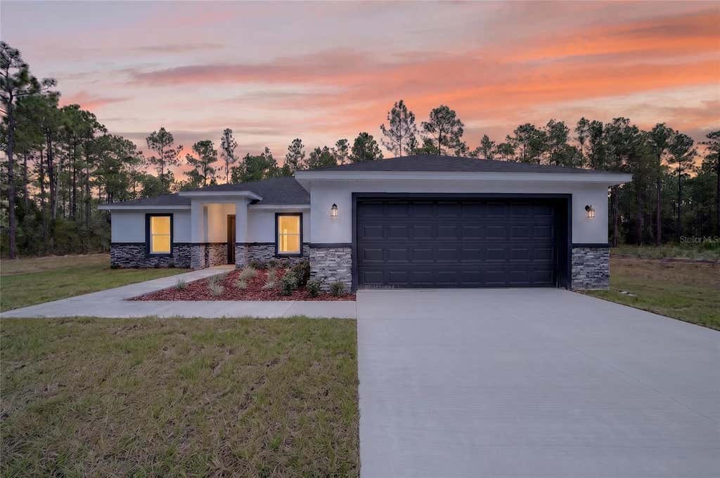 Photo of 23636 NW Water Oak Avenue, Dunnellon, FL 34431 (MLS # O6428325)