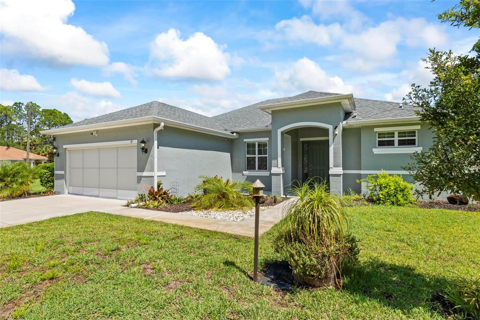 WOW! 3-year-old Everlast, Magnolia model home on huge, oversized lot with adjacent lot included. This home is located at the end of a
Cul-de-sac in the Seminole Woods neighborhood of Palm Coast. The possibilities are endless with all of this space with the back and side yard already fully fenced. There is a large screened in lanai to enjoy those wonderful Florida days and evenings. Inside you will find 42" cabinets, coffee bar, granite counter tops, coffered ceiling, Terrazzo floors throughout and stainless-steel appliances. This spacious 3 bedroom, 2 bath home with oversized 2 car garage is truly stunning. Upon entering the home, you will feel the warmth and comfort put into this build by the owner. Outside you will find nice landscaping, fenced yard, tool shed, a security camera system and an irrigation system on a well. This home is just blocks away from a city park and just a short ride to schools, shopping, hospital and of course the beach. If you ride by you will want to see inside. Don't wait, give me or your agent a call today to schedule your showing.