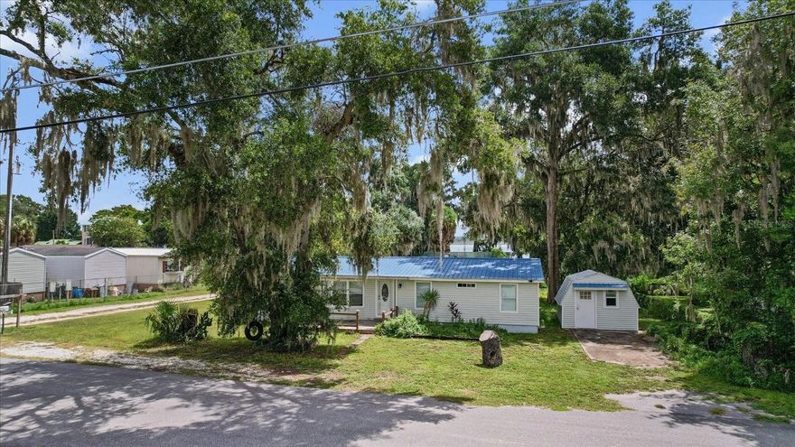 This charming 3-bedroom, 2-bath home offers the perfect blend of comfort and location for lake lovers. Inside, you’ll find a spacious living area anchored by a cozy wood-burning fireplace, ideal for relaxing after a day on the water. The kitchen and dining area flow seamlessly for easy entertaining, while the split-bedroom layout offers privacy for guests. Outside, enjoy the convenience of a storage shed for all your tools and toys. Located just down the street from a popular lakefront restaurant featuring a boat ramp and dock parking, you’ll have quick access to fishing, boating, and beautiful sunsets over the lake. Whether you’re looking for a primary residence, weekend getaway, or investment property, this home delivers exceptional value in a prime location!