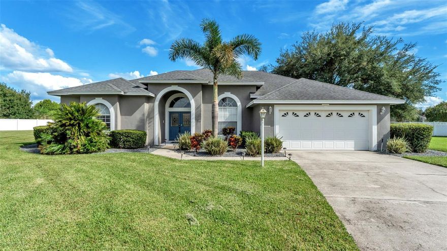 Tucked away at the end of a quiet street in the gated, golf cart–friendly community of Ruby Lakes, this 4-bedroom, 3-bath beauty is all about relaxed Florida living. From the long driveway and two-car garage to the lush, well-kept landscaping, this home gives you that “welcome home” feeling from the very start.

Step through the double front doors and into a bright, open layout that flows beautifully from room to room. Just off the entry, the formal dining room—with its coffered ceiling and sunshine-filled windows—sets the stage for gatherings. The front living area, with tile flooring and sliding glass doors, opens right up to the pool, making indoor-outdoor living a breeze.

At the heart of the home, the kitchen and family room create the perfect hangout spot. The kitchen features solid wood cabinetry, stone countertops, stainless steel appliances, a roomy pantry, and a casual breakfast bar. A cozy nook overlooks the pool, while the family room shines with built-in cabinetry, stone accents, and a rustic brick feature wall that adds warmth and personality.

The primary suite is its own retreat—sliding doors open directly to the pool deck, and the en-suite bath provides dual vanities, a garden tub, and a walk-in shower. The three additional bedrooms are just as comfortable, each with double-door closets, ceiling fans, and soft carpet. With a dedicated pool bath and a full guest bath, the layout is as practical as it is inviting.

Outside, the covered patio is made for lazy afternoons and weekend cookouts. With peaceful views of the pool and backyard, plus a ceiling fan to keep things cool, you’ll want to spend plenty of time out here. The home also includes a laundry room with storage cabinets and a utility sink to keep everything organized.

And don’t forget—you’re in Ruby Lakes, where life moves at a laid-back pace. Cruise around the gated neighborhood by foot, car, or even golf cart, and enjoy the peace of mind that comes with quiet security.

If you’re looking for comfort, style, and a lifestyle that feels like vacation, this is the one. Let’s set up a tour—you’ll want to see it in person!