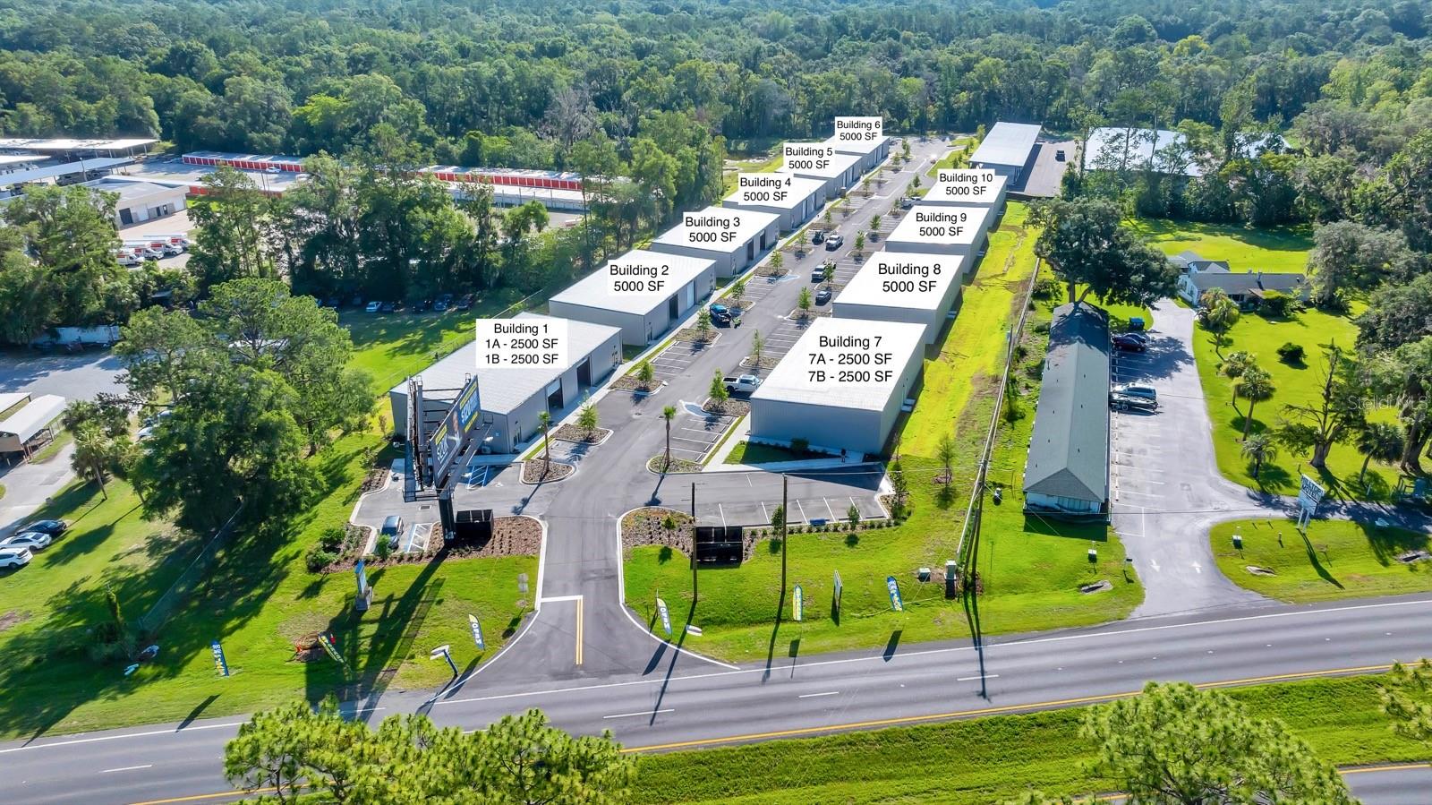 Come explore this newly constructed small bay industrial park, ideally situated along Highway 441 in Ocala. The property features 10 custom-built warehouse buildings, each 5,000 square feet in size. Five of the buildings are divided into two 2,500 square foot units, each equipped with a small office and ADA-compliant bathroom. The office spaces measure approximately 14’6” by 13’8” and are finished with new vinyl plank flooring. Bathrooms are 7’10” by 5’5”. Each unit includes a 12-foot wide by 14-foot tall overhead door and is individually metered with 200-amp power service, with upgrade capacity available if needed. The space is move-in ready with power already on. Parking is unassigned but provides the equivalent of seven spaces per 5,000 square foot building. Leases are structured as NNN with a preferred minimum term of three years. This property has a common dumpster area, keyed mailboxes, and there are no limitations on the hours of operation. New tenants will be provided with 4 electrical outlets to be placed at location of the tenants choosing. The larger 5,000 SF warehouses can be air-conditioned at no additional cost to the tenant. The smaller 2,500 SF units will have an office A/C at no additional cost, and the warehouse portion can be air-conditioned at tenant's expense.
In addition to the industrial space, the property includes a covered RV and boat storage facility located at the rear of the park. This area offers 76 covered and paved storage spaces, each available for $325 per month with a minimum lease term of 13 months. Each storage space is equipped with 20-amp power service and an on-site sanitation station included with the lease.