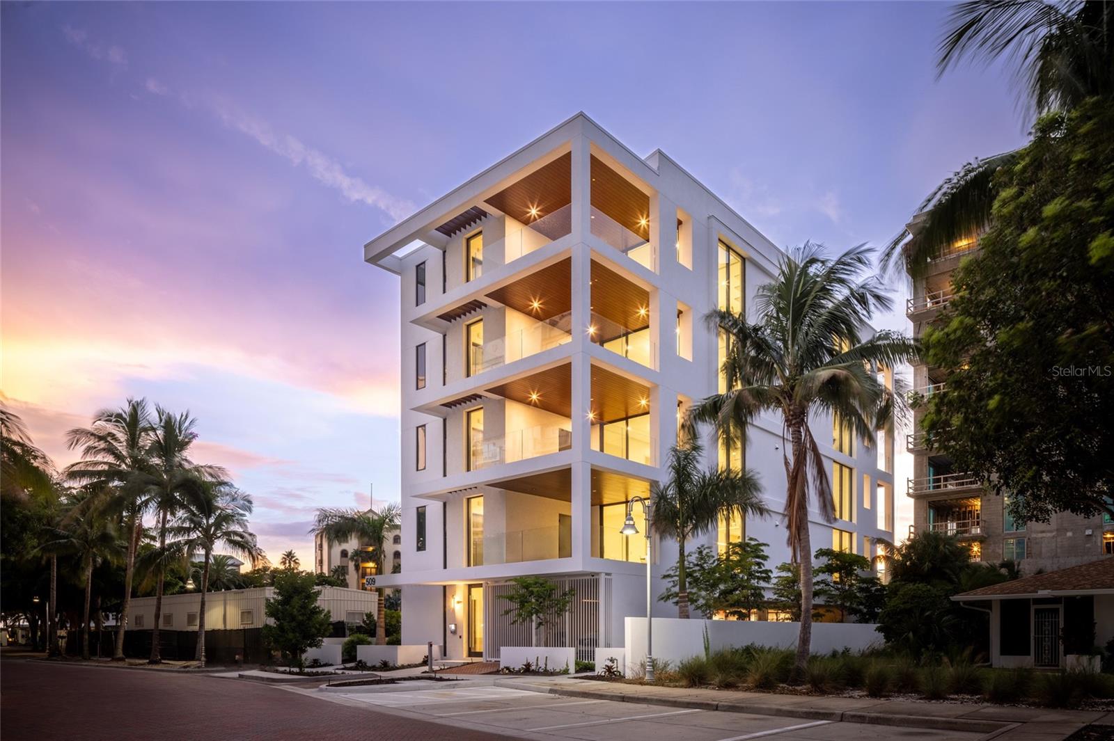 Owner will consider holding financing for this beautiful condo residence that is priced to sell and will also forgo the first year’s HOA fees. New Construction Move-in Ready! Golden Gate's Newest Condominium! Relish a luxurious, carefree lifestyle in this beautiful full-floor residence in En Pointe, a four-unit condominium in Golden Gate Point, ideally situated between the Ringling Bridge and vibrant downtown Sarasota. The 2,439-square-foot residence features 3 bedrooms and 3.5 bathrooms. Two private covered terraces and walls of glass showcase scenic views at every turn, including the bay, Ringling Bridge, downtown and marina. Designed by Echt Architects and constructed by Nautilus Homes, each En Pointe residence features refined craftmanship and modern features, offering a convenient lock-and-leave lifestyle. From the condominium’s private lobby, an elevator transports you to your private entry foyer. At the center of the flow-through floor plan is a chef-inspired kitchen, flanked by the spacious living room and dining room. The living room seamlessly transitions to the sunset terrace, while the dining room opens to the sunrise terrace – perfect for relaxing and entertaining. The generous primary suite includes a spacious walk-in closet, double vanities, large shower and soaking tub. The bedroom offers access to the sunset terrace, boasting picturesque views to the north and west, while abundant natural light floods the south-facing primary bath. There are also two additional en-suite bedrooms. En Pointe’s amenities include a 7’x36’ heated saltwater pool with a bench, plus elevated decks for lounging and dining. Each unit includes two dedicated covered parking spaces, an electric car charger and secured ground-floor bike parking. A lively downtown lifestyle awaits nearby, including abundant fine dining, shopping and cultural arts, with easy access to St. Armands Circle and Lido Beach, less than 3 miles away.