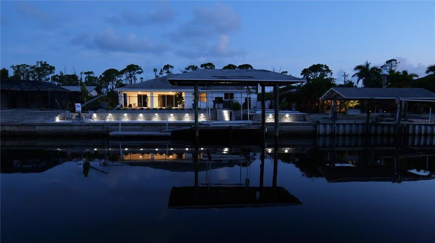 ***LOCATION, LOCATION, LOCATION*** Unbelievable opportunity! Take advantage of the Assumable loan of only 2.375%!!! WOW! We will probably never see rates this low again!! Waterfront Luxury with Unmatched Views & Quick Gulf Access! This beautifully upgraded 3 bed, 2 bath home offers the ultimate Florida lifestyle with a solar-heated pool, above-ground hot tub, and breathtaking views of an intersecting canal—just 2 minutes to open water! Enjoy effortless boating with a covered electric boat lift, a private kayak launch, and oversized lot (.33+ acres) complete with private parking across the street for your RV, trailer, or extra toys. Inside, you'll love the spacious living area with tile flooring throughout, quartz countertops, and high-end Jenn-Air stainless steel appliances with an induction cooktop in the grand kitchen. Step outside to an entertainer’s dream—featuring an outdoor kitchen, gorgeous decking, a covered lanai, and ample room for gatherings. The fenced-in yard featuring a grass dog run, also includes his and hers sheds. Th front yard is adorned with many ornamental plants and zero-maintenance landscaping for easy living. This home has it all—location, luxury, and lifestyle. Whether you're a boater, entertainer, or simply looking to relax in paradise, this one checks every box!