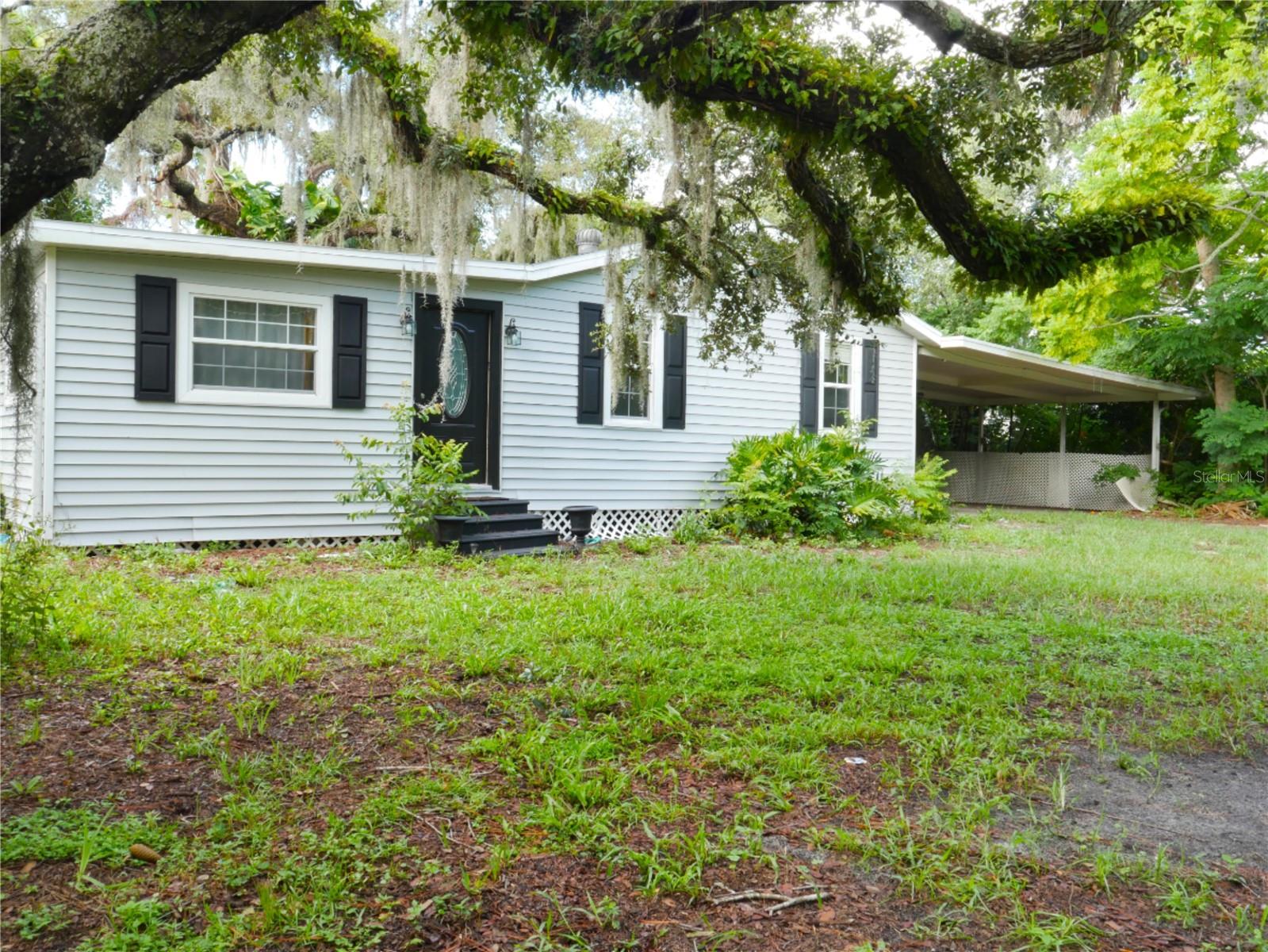 One or more photo(s) has been virtually staged. Charming Port Orange Retreat on Nearly 1 Acre! Discover the perfect blend of privacy, potential, and natural beauty with this rare find in the heart of Port Orange! Nestled at the end of a peaceful unincorporated dead-end street, this high and dry property sits on almost a full acre surrounded by lush mature foliage and majestic live oak trees, creating a serene and private setting that’s hard to come by. This classic stick-frame home exudes character and awaits your personal touch. While it could use a little TLC, it offers a solid foundation and endless possibilities to create your dream retreat. Imagine morning coffee under the shade of thriving oaks, evenings spent entertaining in your expansive backyard, or simply enjoying the quiet privacy that this hidden gem affords. With its prime location in desirable Port Orange, you’re just minutes from top-rated schools, shopping, dining, and the world-famous beaches, yet tucked away in your own private oasis. Highlights you’ll love: Valuable improvements including new roof (2020) and new septic system (2022). Nearly 1 acre of land, room to spread out, garden, or even expand. Private & peaceful dead-end street with minimal traffic. Towering live oak trees & mature landscaping for natural beauty and shade. High & dry lot offering peace of mind and lasting value. Endless potential to customize to your style. Don’t miss this rare opportunity to own a piece of paradise in one of Port Orange’s most convenient yet tucked-away locations. With its unbeatable setting and potential, this property is ready to be transformed into the home you’ve been dreaming of!