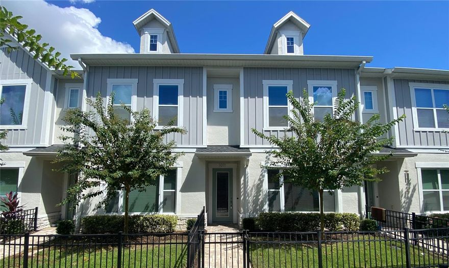 An amazing opportunity to live in this beautiful 2 Bed 2.5 Bath new construction townhome in one of the most desirable gated & master planned mid-town communities of Griffin Park in Lake Mary. The home has a bright exterior finish boasting a pavered walkway, a unique fenced front porch and a rear 2-car garage. Set foot onto porcelain wood plank tile floors with molded baseboards that run on the same style and finish throughout the first floor. Open concept on the main floor with tons of natural light filtering throughout the home. A spacious living/dining room combo flows right into the kitchen that boasts 42 inch modern cabinets wrapped in Calacatta Alpha Quartz, exotic backsplash and accented with elegant hardware. This kitchen showcases a well-appointed island also wrapped in Calacatta Alpha Quartz and all-stainless steel GE Kitchen Appliances. The carpeted staircase leads you to all of the bedrooms upstairs. Walk through the hallway into the master suite featuring a walk-in closet and a magnificent master bath. The master bathroom boasts dual vanities with granite counter tops and white shaker style vanities with stainless-steel hardware & chrome faucets along with a glass standing shower that has intricate wall tiles & shower niche. The additional carpeted bedrooms are spacious and feature ample closet space for all your storage needs. An additional bathroom with a garden tub/shower combo is shared by the two additional bedrooms. Enjoy your day with your dog at the dog park or go for a leisure walk in Griffin Park’s walking trail. Grocery stores, dining, shopping, a 24 Hour gym are all within walking distance. Relax at the community’s large resort-style pool that has a cabana and the Legacy Lawn fire-pit that features a patio with sunchairs and lounges. Zoned for amazing Seminole County Schools. Directly off of Longwood Lake Mary, steps away from Lake Mary High School, and minutes away from I4 and other major roadways. Downtown Lake Mary in less than 5 minutes! Head to downtown Orlando or Universal in less than 45 minutes. Travel to Disney or the beaches in less than an hour. Experience true Florida living and schedule your private tour today!