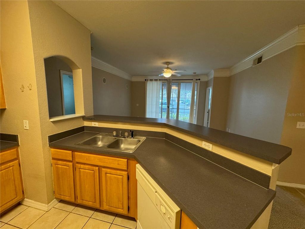 Photo of 6685 Queens Borough Avenue #107, Orlando, FL 32835 (MLS # O6379598)