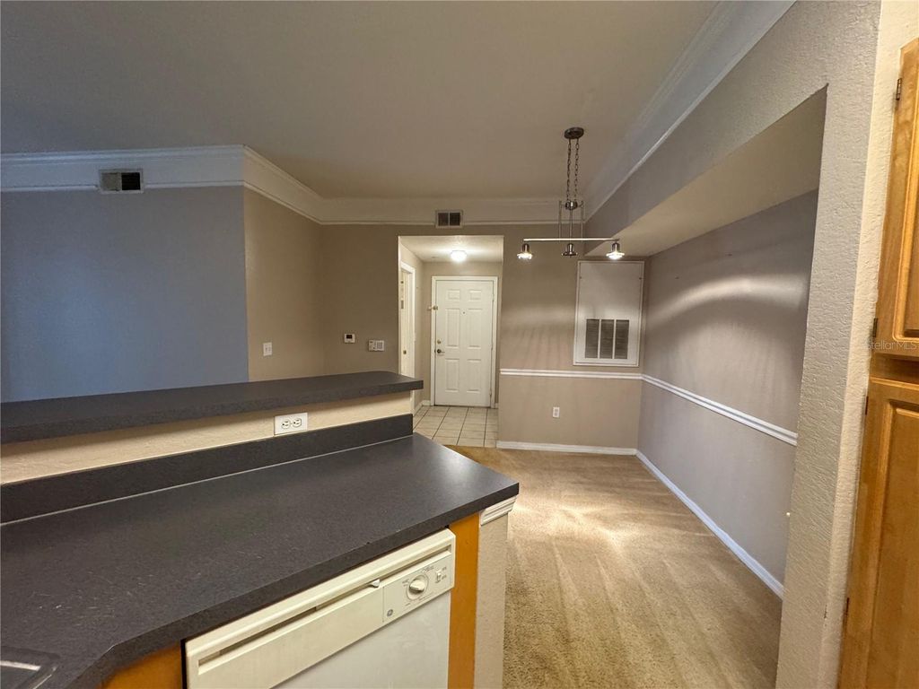 Photo of 6685 Queens Borough Avenue #107, Orlando, FL 32835 (MLS # O6379598)