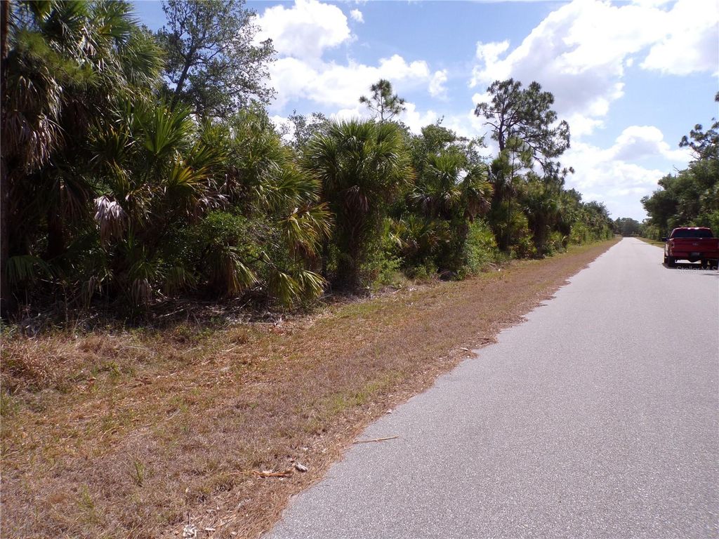 Photo of 14448 Mcmillin Avenue, Port Charlotte, FL 33953 (MLS # C7509411)