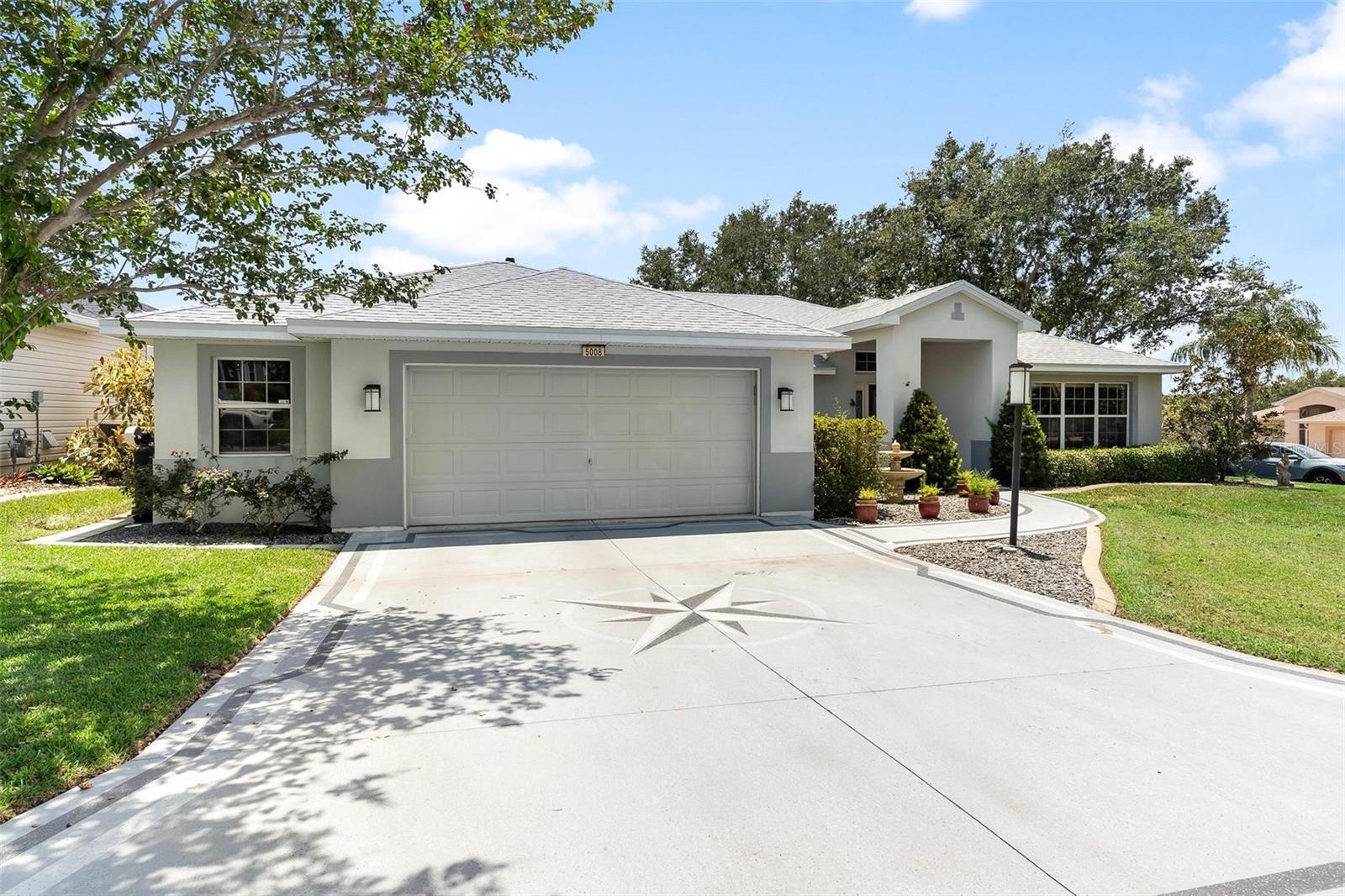 This quality custom home, in the prestigious 55+ Waterfront community of Royal Harbor, sits proudly on an extensively landscaped corner lot. Enjoy the lushly landscaped Garden oasis in your own backyard, complete with pathways, pond and fountains, and a custom irrigation system for each area. The lovely front entry with leaded glass front door and custom stained glass transom window welcomes you and your guests. Once inside, you will immediately appreciate the thoughtful custom floor plan, with a large Great Room , Dining Room, and living Room/Den/Office/Bonus Room. The Great Room, with gas fireplace, provides access, through large sliders, to a large Screened Lanai with beautiful pavers, and is open to the spacious Kitchen and inviting Breakfast Nook, all overlooking the Garden Oasis, pond, and fountains. The Kitchen also includes a large breakfast bar and has ample solid wood cabinets and Corian countertops. The Primary Suite provides the retreat you deserve, with vaulted ceilings, oversized walk-in closet, and ensuite Bath featuring a large walk-in shower and double vanity. Your guests will also appreciate the privacy provided by the Guest Wing of this nicely designed 3 bedroom Split Plan. The Garage just may be your favorite thing, with 763 square feet of wonderful space for you to use and enjoy. It is set up with a large workshop area and a separate area for special creative projects. There is lots of space for storage, toys and cars too! This home has been very well maintained, and has a New Roof installed 2-2025, and New A/C in 2024. This home is ready for you to move right in and enjoy the lifestyle you deserve, in the community that has it all! Royal Harbor on the Harris Chain of Lakes, is a great community, with all the Amenities and Activities that you would expect! Enjoy the Clubhouse, with Social Hall, Fitness Center, Library, Billiards, Pool and Spa. Play Tennis, Pickleball, Bocce and Shuffleboard. Enjoy the Community Docks. There is even RV, Boat and Trailer Storage. Come make new friends and live the lifestyle you have been dreaming of. Call today for your private showing.