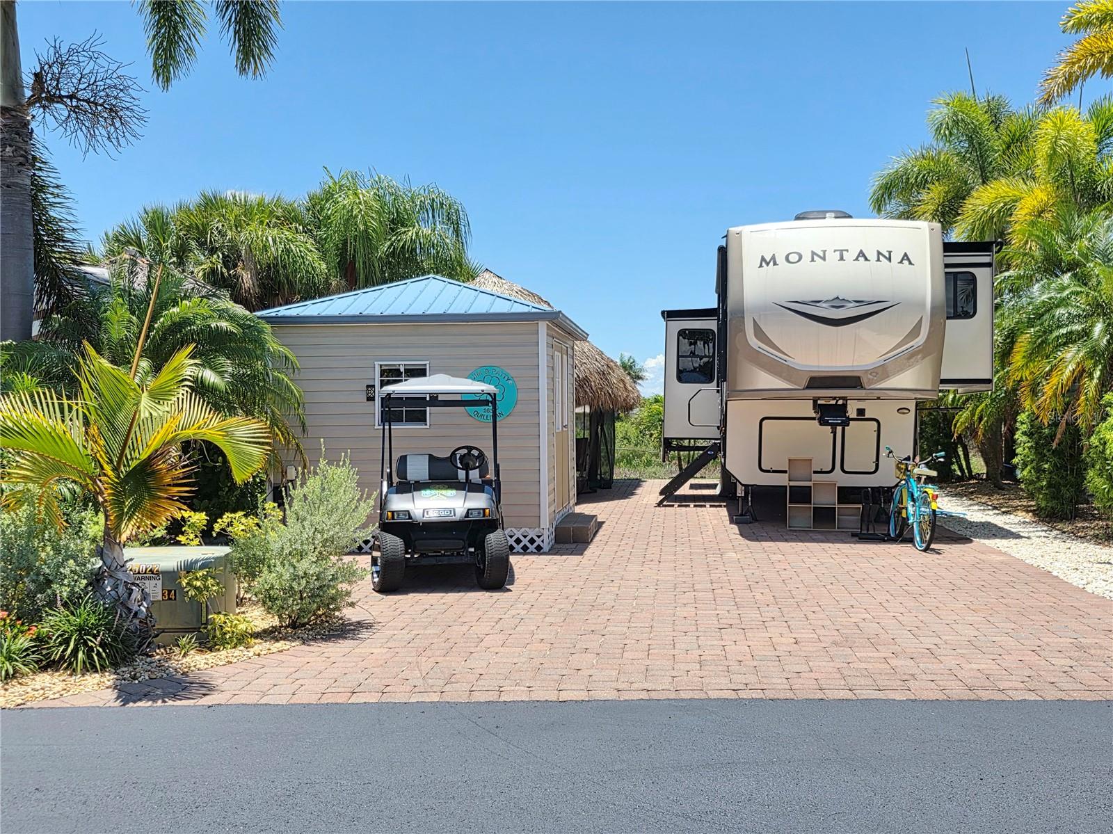 SILVER PALMS 5 STAR RV RESORT - This beautiful property is on the preserve that is teeming with wildlife in the rainy season. The landscaping is superb. Sitting in your Tiki in the evening watching the spectacular sunsets, the Tiki is all screen in for your comfort. The Tiki is 10 x 28, Casita is 10 x 12 and you can build to your own specifications. The property includes a 2020 Montana 5th Wheel. It has hydraulic jacks, pantry, washer/dryer. This is an active resort with Nine (9) pickleball courts, spacious clubhouse, heated pool, Jacuzzi, poolside bar and grill, fitness center, billiards room, fitness center, card room and much more. Golf cart comes with the package, all six batteries were replaced in December 2024. Roof on camper redone in December 2024. This is right across from the clubhouse. Perfect location.