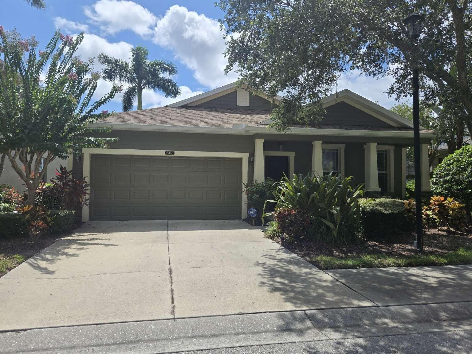 3 bedroom, 2 bath single family home in Palmer Oaks community in Sarasota. New roof, new gutters, new A/C and new refrigerator. Located on a quiet and shaded lot with a tree-lined street. Watch the sunrise on the covered front porch, and watch the sunset across the lighted fountain pond view from screened lanai and master bedroom. Never mow the grass again as HOA includes neighborhood maintenance and lawn/sprinkler care. House has 2 main living room areas for privacy, and the Kitchen is equipped with stainless steel appliances and granite countertops and island. Primary bedroom has a walk-in closet with a granite double vanity with a separate tub and shower. Tile floors throughout main areas with carpeted bedrooms. Attached two car garage opens to the separate laundry room. Gated community, sidewalks, private lakes, and fountains throughout the neighborhood. Newly resurfaced heated pool has loungers and bathrooms along with a covered area and palm trees for shade. Walking distance to grocery stores, shops and restaurants. A short bike ride to the Legacy bike trail. A few minutes to I-75 and 15 minutes to Siesta Key.