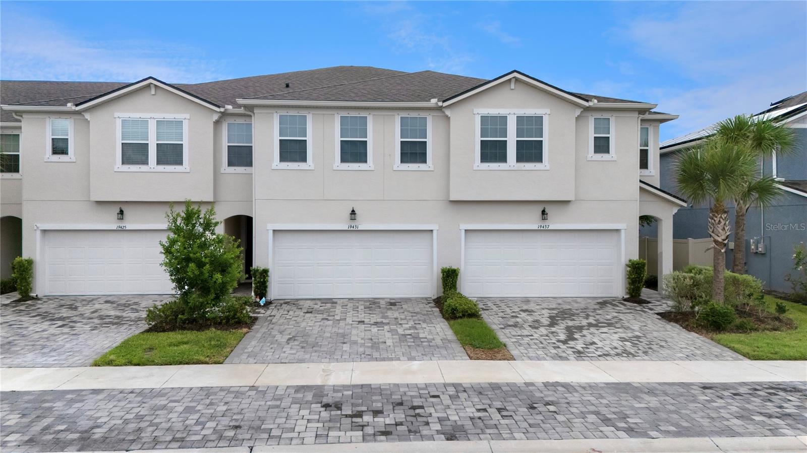 Modern Living Meets Ultimate Convenience in this Spacious Lutz Townhome!
Welcome to Monarch Wind Way, where contemporary style, generous space, and maintenance-free living come together in one of Lutz’s most desirable gated communities. This 4-bedroom, 3-bathroom townhome with an oversized bonus room and 2-car garage offers the perfect blend of form and function—ideal for young families, professionals, or anyone seeking a newer home with room to grow.
With over 2,400 sq ft of thoughtfully designed living space, you’ll love the open-concept layout, tall ceilings, and elegant finishes throughout. The first floor features wood grain ceramic tile flooring, a spacious great room, and a full guest suite with its own bathroom—perfect for multigenerational living, visiting guests, or a private home office.
The kitchen is the true heart of the home, showcasing quartz countertops, staggered cabinetry, a glass subway tile backsplash, stainless steel appliances, a deep single-bowl sink with gooseneck faucet, and a custom wood-shelved mudroom area for everyday organization.
Upstairs, retreat to the spacious primary suite, which features a luxurious en-suite bathroom with dual vanities, a soaking tub, a separate walk-in shower, and a large walk-in closet. Two additional bedrooms—each with their own walk-in closets—share a full bathroom with dual sinks and a tub/shower combo. The expansive bonus room offers flexible space for movie nights, gaming, a playroom, or a second living area.
Enjoy your morning coffee or evening wine on the screened-in lanai, providing peaceful outdoor living without the hassle. And because this home is part of a low-maintenance townhome community, exterior maintenance is handled for you—giving you more time to enjoy everything this growing area has to offer.
Located between Highway 41 and the Suncoast Parkway, you’ll have easy access to Tampa, excellent schools, shopping, restaurants, and all the recreational amenities of Land O’ Lakes and Lutz. The community itself offers a walkable lifestyle with amenities just steps away.
If you’re looking for a stylish, low-maintenance, move-in-ready home with plenty of space in a prime Lutz location, don’t miss your opportunity to see this one. Schedule your private showing today!