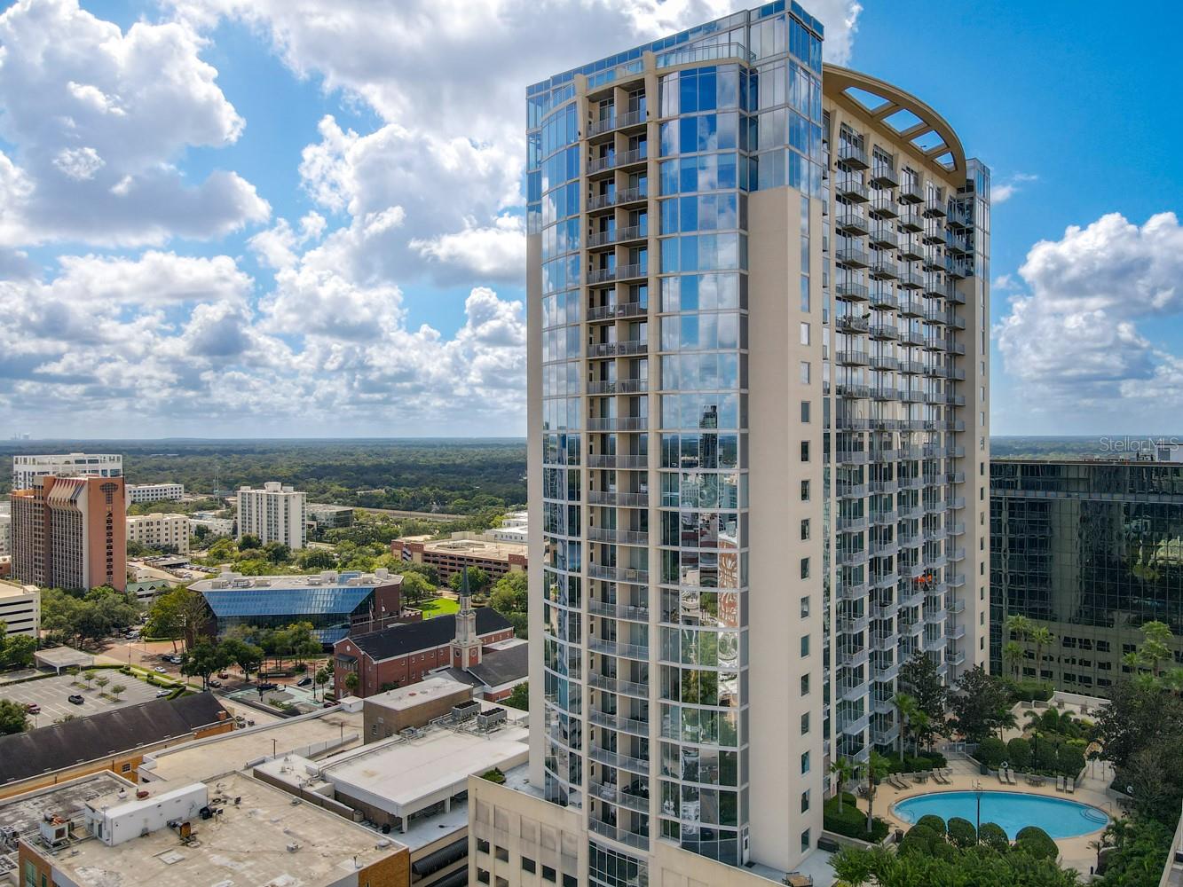Located in the heart & pulse of downtown Orlando! This stunning 1-bedroom 1-bath condo is located on the 19th floor with floor-to-ceiling windows. Granite counters, wood and tile floors, stainless steel appliances, a walk-in closet with laundry in the bedroom built-in desk/bar, private parking, city views from your balcony, which overlooks your pool, are only a few of the great features. 24/7 Concierge desk, media center, pool & fitness center, and key fob access to the building. Walk out your building's door to many of the great downtown perks, such as restaurants, shopping, nightlife, lounges, Dr. Philps center, and so much more offered here at The Solaire at the Plaza.
