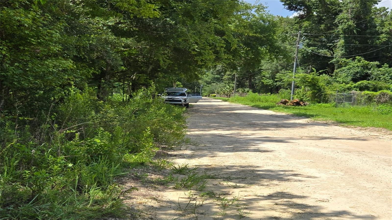 Beautiful and serene, this over half-acre parcel in the heart of Rainbow Park has no HOA and offers unparalleled potential and flexibility. Situated in a desirable location just a few minutes away from the World Equestrian Center, Juliette Falls Golf Course, shopping, and dining, this corner lot has a ton of potential. Enjoy the freedom of a zoning that allows for both manufactured and site-built homes. Enjoy the low taxes and the freedom to create the home of your dreams without being bound by an HOA, all within the beautiful surroundings of Ocala. Don't miss out on this prime real estate opportunity!