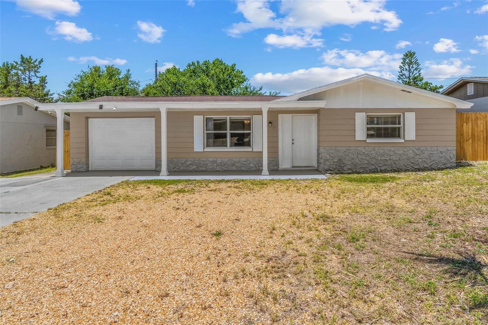 Welcome to 3307 Briar Cliff Drive, a charming 3 bedroom, 1 bath single family home located in the heart of Holiday, FL! Built in 1967, this property is in a NO flood zone with no HOA or CDD and is a solid concrete block home that offers a thoughtfully designed living space that combines timeless durability with comfort and charm. Inside, you’ll find a bright, functional layout, a spacious living area perfect for cozy nights or entertaining, and a well equipped kitchen. An attached garage provides secure parking and extra storage, and the fully fenced lot is ideal for pets. MAJOR updates and FEATURES to note: New roof June 2025, replaced HVAC and ducts 2019, water heater 2019, New laminate flooring June 2025, updated bathroom 2025, New fence 2025, replaced windows 2019, and an updated kitchen 2019 with a new oven. Just beyond your door, you’re only 2 miles (~5 minutes) from the sandy shores of Howard Park Beach, 4 miles (~10 minutes) from Anclote River Park, and 8 miles (~15 minutes) from Honeymoon Island. Enjoy the best of the Florida lifestyle with world class Clearwater Beach and its famous Pier 60 just 20 miles (~30 minutes) away. Frequent travelers will love the easy access to both St. Pete Clearwater International Airport (25 miles, ~35 minutes) and Tampa International Airport (29 miles, ~36 minutes), making this an ideal location for work, play, and everything in between. Don’t miss this rare opportunity to own a move in ready home with timeless charm, endless potential, and convenient access to beaches, airports, shopping, and the laid back coastal lifestyle that makes Holiday such a desirable place to call home! Schedule your tour today!