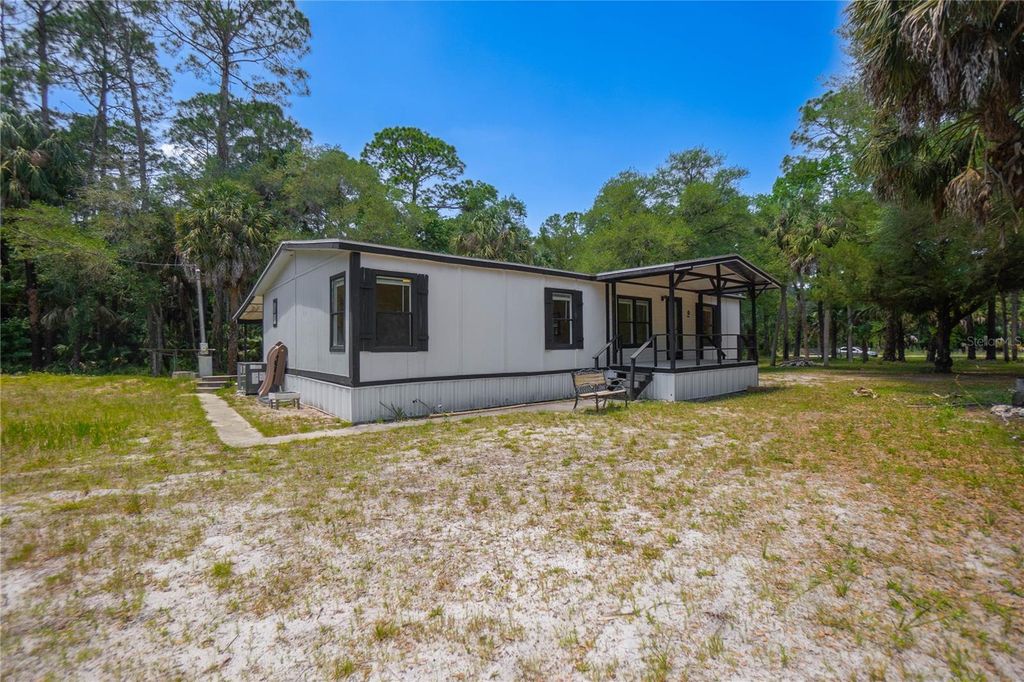 Photo of 6550 SE Debra Avenue, Inglis, FL 34449 (MLS # W7885509)