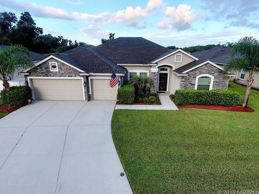 Extremely desirable 4 bedroom, 3 bath split floor plan home in Sugar Mill Gardens with additional private office, 3 car garage. Whole house generator utilizing an automatic transfer switch. Like new home with many upgrades including sun tunnels and new roof in 2017. Featuring a flowing open floor plan, a large master suite with a spacious sitting room, two walk in closets overlooking the custom paver patio. The master bath has double vanities, a garden tub & a large walk in shower. The upgraded 4th bedroom is an ensuite bedroom with full bath,shower and tub and two separate sinks and large walk in closet suitable for that special guest. Chef's dream kitchen. This huge kitchen has custom 42" cabinets, dual GE Profile electric ovens, GE Profile natural gas cook top, GE Profile dishwasher, granite counter tops and walk in pantry. A custom bay window dinette with storage underneath is perfect for dining. Spacious living room separates the master suite and office from the kitchen and family room. Tankless natural gas hot water heater enables endless hot water. The 3 car garage was finished with sealed floors and insulation above. Storage is also available in attic via drop down stairs. A 6' vinyl fence with two gates allows privacy while in the yard. The custom pavers on patio has a footer already poured to allow future enclosure installation. This home has great curb appeal as it is professionally maintained, with zone irrigation, gutters, downspouts, storm shutters. Located close to the beach, shopping, dining and easy access to I -95. ;Water: City