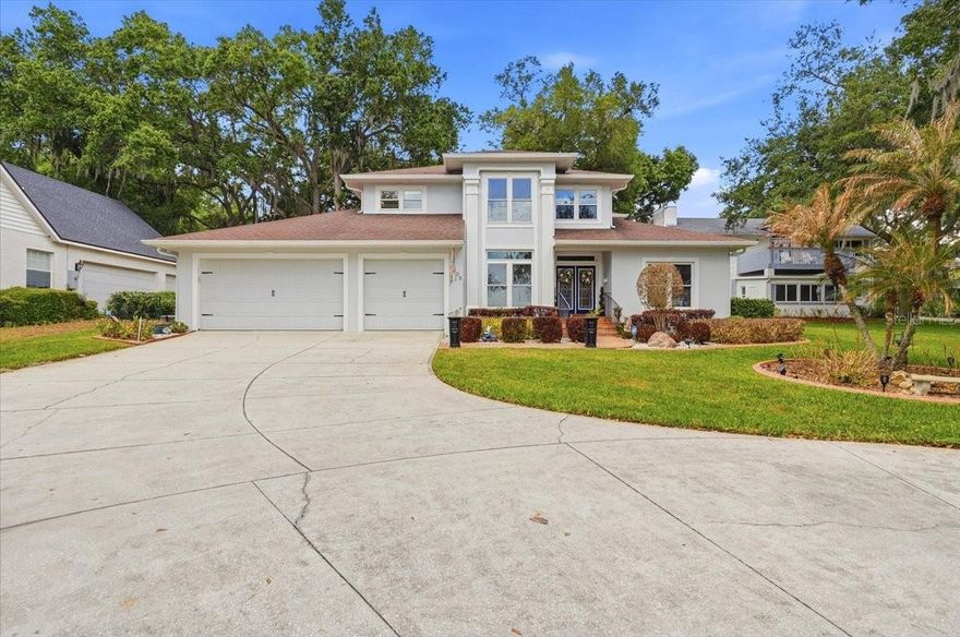 Located on beautiful Lake Ariana, this stunning and meticulously maintained, 3-bedroom, 3-bath, 3-car garage home offers both comfort and style in an exceptional waterfront setting. Porcelain tile runs throughout the home, creating a clean and cohesive look.
The home features a spacious family room, formal living and dining areas, plus a private office that can easily serve as a 4th bedroom, with convenient access to a guest bath. The kitchen is beautifully appointed with granite countertops, wood cabinetry, a double oven, a built in microwave and cooktop—perfect for both everyday living and entertaining.
The laundry room is generously sized and includes a custom-built drop zone for added functionality. Step into the sunporch and enjoy peaceful views of the private backyard, designed for entertaining with a custom fire pit and a unique bi-level layout that adds to its visual appeal.
Upstairs, the owner’s suite is a private haven, boasting an ensuite bath with a walk-in shower, garden tub, double sink vanity, and a water closet equipped with a laundry chute, plus a spacious walk-in closet. Two additional generously sized bedrooms are located just steps away from a tastefully designed bath with quality finishes. 
Enjoy true Florida living with lakefront features that include a screened deck and direct access to your private boathouse, complete with electric, water, and a boat lift.
Recent updates include two new AC units, a new water heater, fresh exterior paint, and a professionally coated garage floor by Tru Grit Coatings—adding both value and peace of mind.
This home is ideally situated near both Interstate 4 and Polk Parkway, offering easy commuting throughout Central Florida.  Enjoy quick access to Florida's beautiful beaches and major attractions. Whether for work, play, or weekend escapes, this location provides easy access to the best of Florida living.