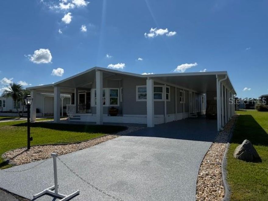 Beautifully maintained 2 bedroom, 2 bath home with laminate floors throughout and many upgrades. Open dining room and living room with vaulted ceilings. Kitchen with new appliances, tile flooring and "Corian Style" solid surface countertops. The kitchen leads to a lovely morning nook where you may enjoy your morning coffee. From the living room is an entrance to a 10' X 20' finished Florida room. On the way to the bedrooms, you will pass 3 closets in the hallway for linens and storage. The large primary bedroom is brightened by corner windows and features a lighted double walk-in closet. Passing through sliding French doors into the primary bath with a skylight, double-sink vanity, dressing table, garden tub and walk-in shower. The guest bedroom provides a lighted walk-in closet and is large enough for a queen-size bed. The guest bath features a vanity, tub/shower and skylight. Entering from the covered carport you will find the inside laundry with washer and dryer, along with multiple cabinets and a built-in desk. The home has Weathertight (PGT) windows (2016), Trane HVAC (2023) and a newer membrane roof (2020), a new epoxy drive and walkway (2025), a finished storage shed, and landscape featuring curbing, stones and a front planter. This is a must-see home! 
Enjoy this beautiful home in La Casa, a resident-owned community for persons 55+. La Casa offers the ultimate lifestyle on Florida's gulf coast, located between Sarasota and Fort Myers, welcoming you to the good life with loads of recreation, 2 clubhouses, 2 heated pools. There is no shortage of activities in La Casa. Come and see all that La Casa has for the enjoyment of its residents and guests.
