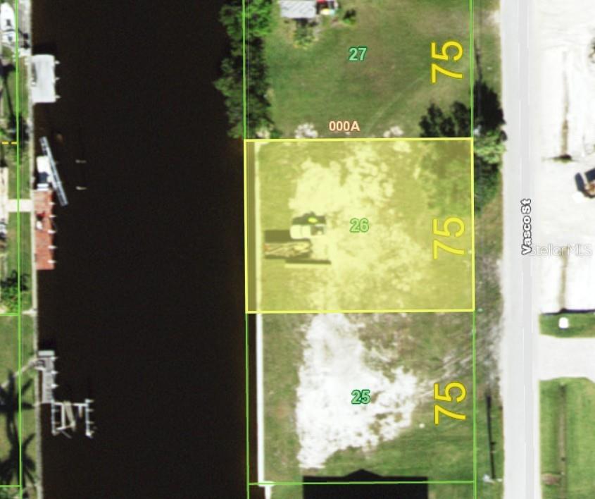 This vacant lot is a boaters dream to build your ideal forever home. It is only a few minutes out to Charlotte Harbor and the Gulf Of Mexico. This lot is on a direct access sailboat canal. There are no Deed Restrictions or HOA's on this side of the street. This lot has had a NEW seawall installed & capped (permitted and closed, 2021). This lot also has city water and sewer available, the only road south of Rio Villa.