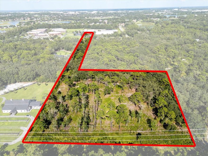 Prime development opportunity on one of Lake Mary’s most prestigious roads—this 5-acre parcel with direct Markham Woods Road frontage offers the potential to create up to five luxury estate homes. Zoned A-1 with future land use designation of Planned Development (PD), the property is ideally positioned for a high-end residential community, surrounded by multimillion-dollar estates and across from Heathrow Elementary. With limited remaining land in this sought-after corridor, this is a rare chance for investors to deliver a boutique enclave in one of Central Florida’s most desirable markets, just minutes from I-4, top-rated schools, and major employers.